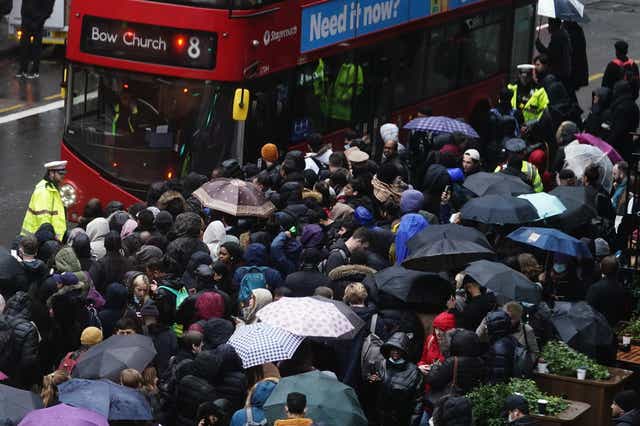 People wait for buses at Liverpool Street station in central London during a strike by members of the Rail, Maritime and Transport union (RMT) (Aaron Chown/PA)
