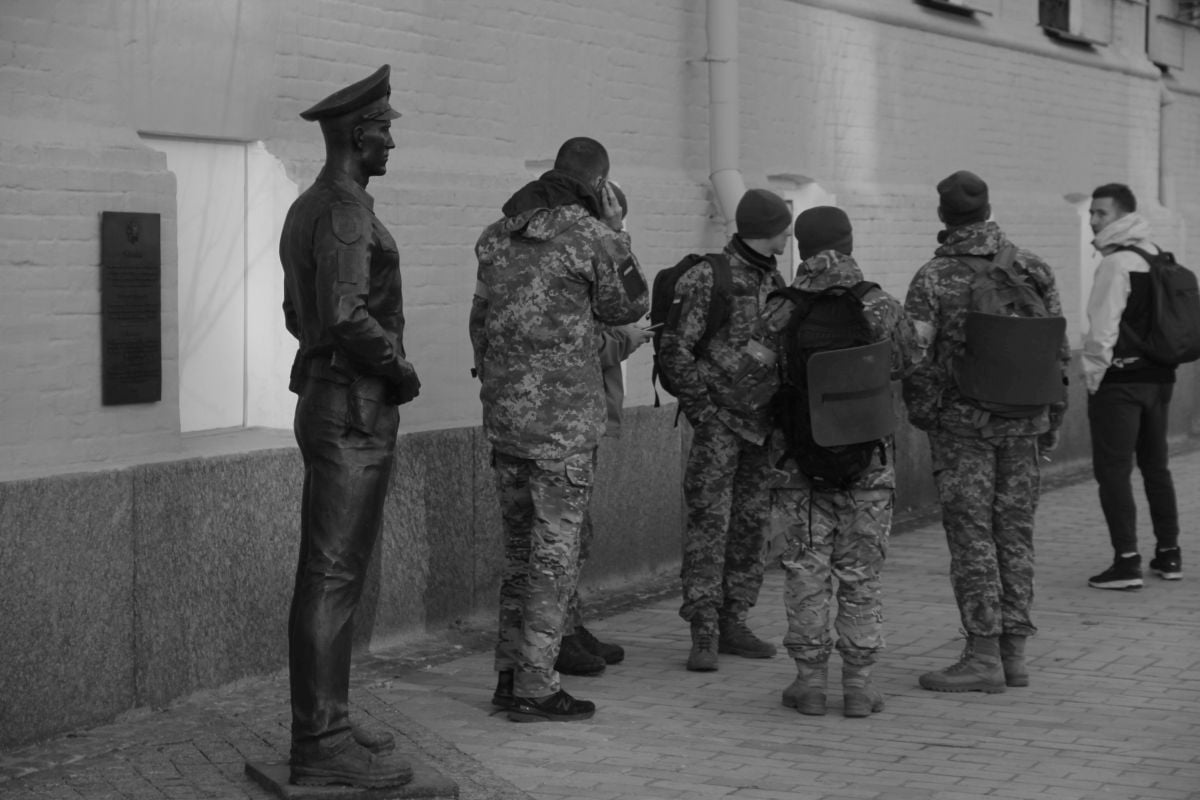 The black and white photographs, shot on a Canon 60D, depict Ukrainian soldiers, civilians and the destruction seen on the streets on her hometown. (Maria Volkova/PA)