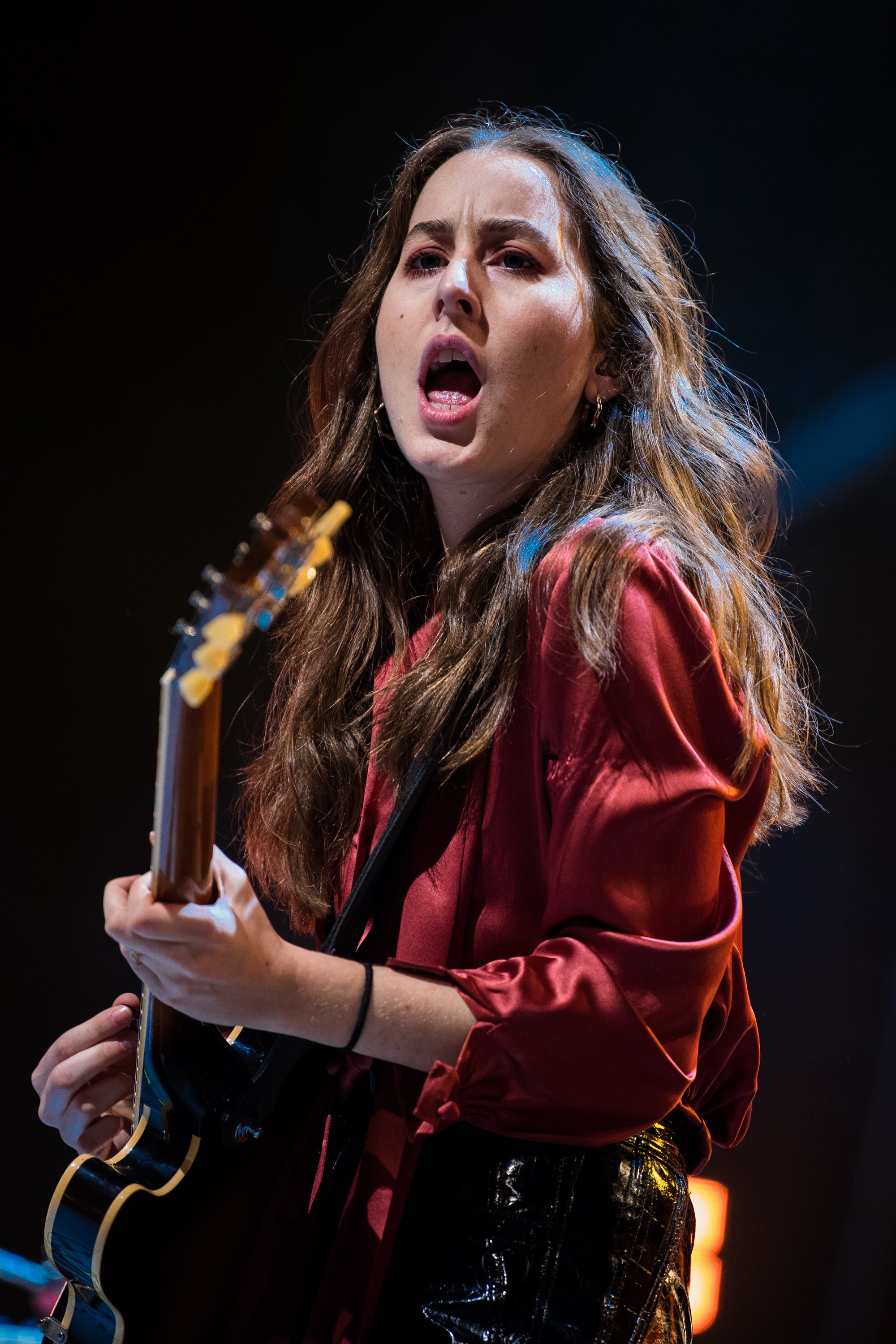 Haim performs on stage in 2017