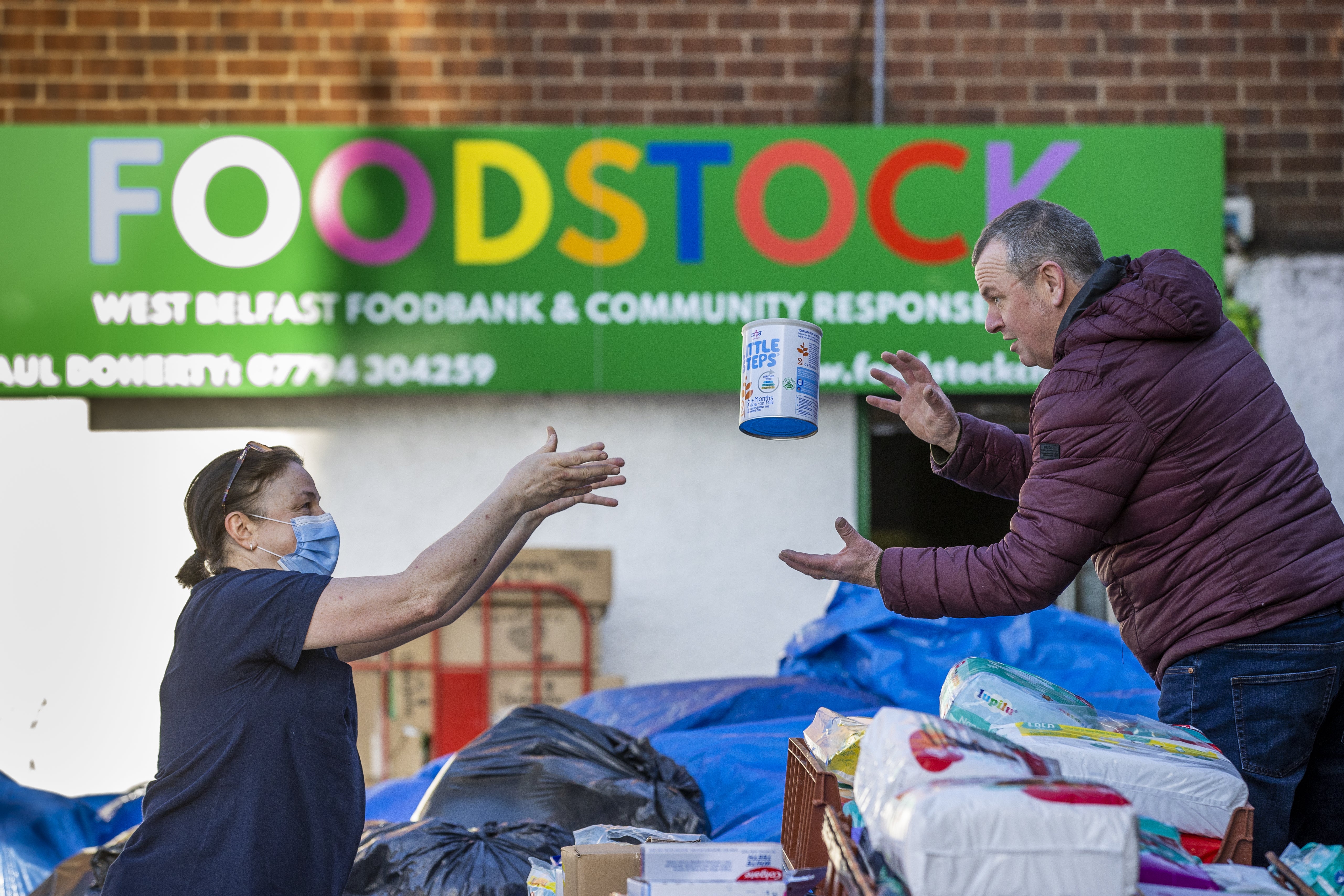 Volunteers at Foodstock in west Belfast sorting supplies that local people to have donated for people in Ukraine. (Liam McBurney/PA)