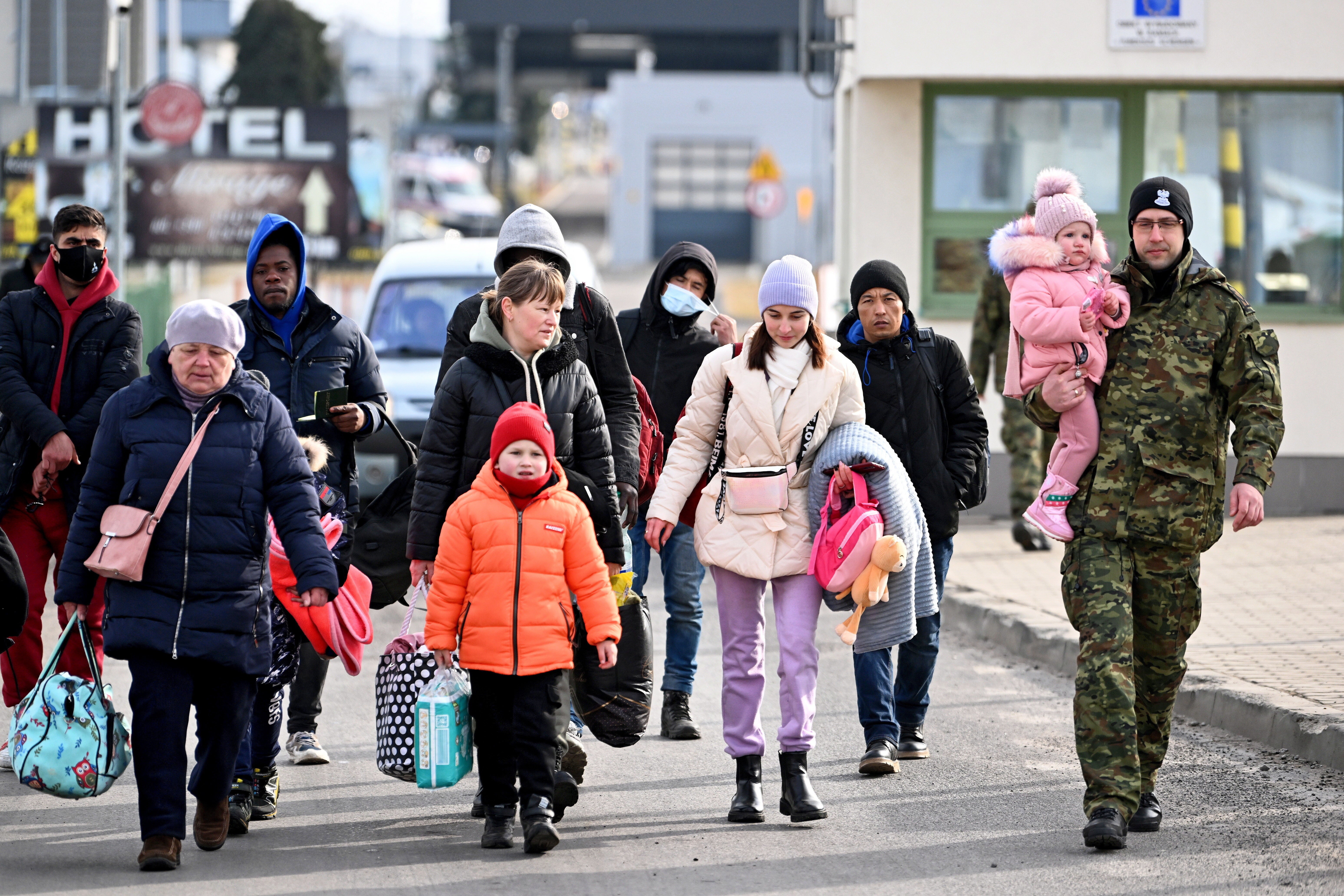 Ukrainian refugees arrive at the Polish border in Medyka, Poland on Tuesday