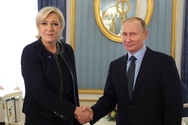 <p>Russian President Vladimir Putin shakes hands with Marine Le Pen, French National Front (FN) political party leader, during their meeting in Moscow, Russia 24 March, 2017</p>