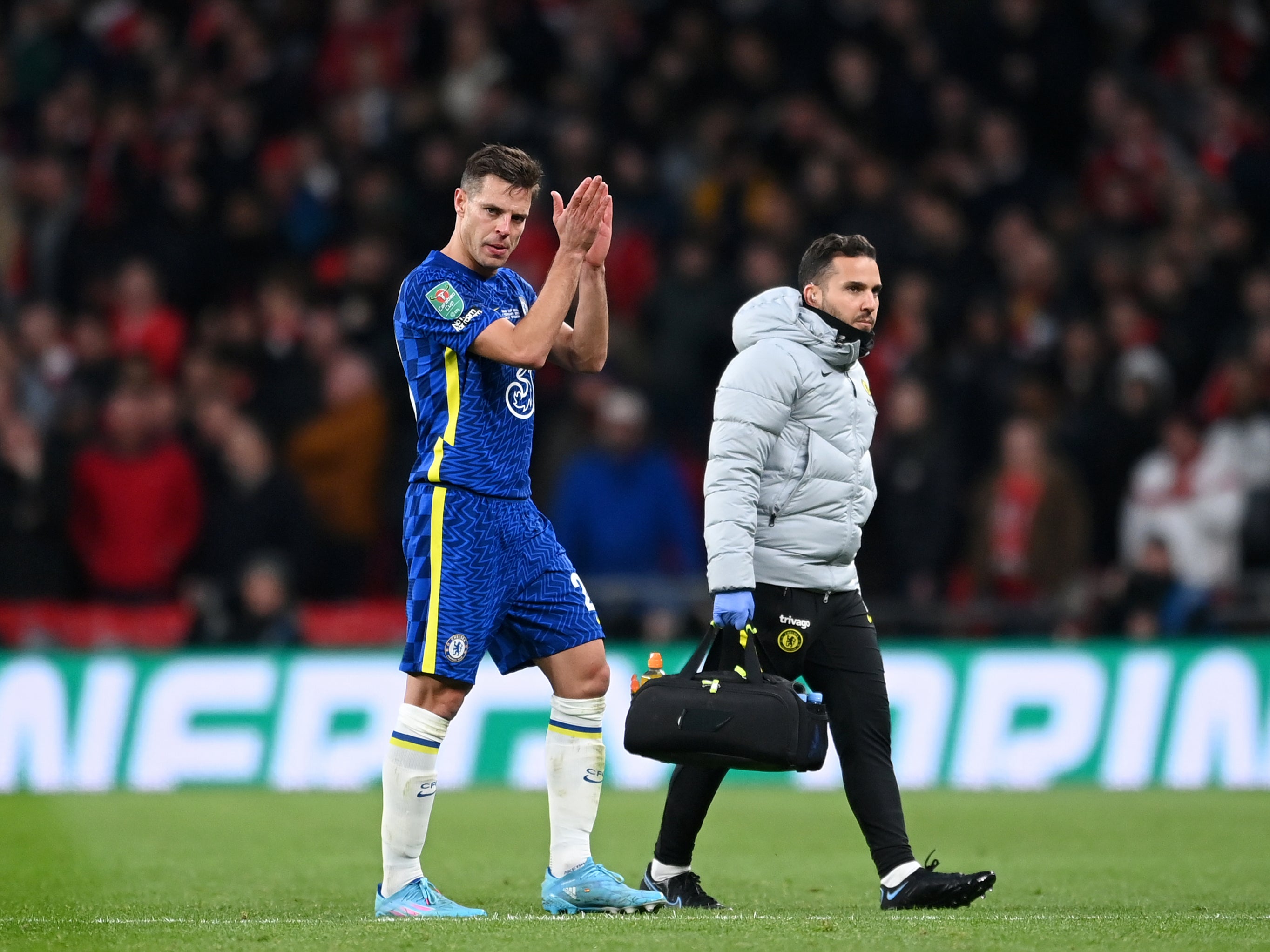 Cesar Azpilicueta of Chelsea goes off with an injury during the Carabao Cup final