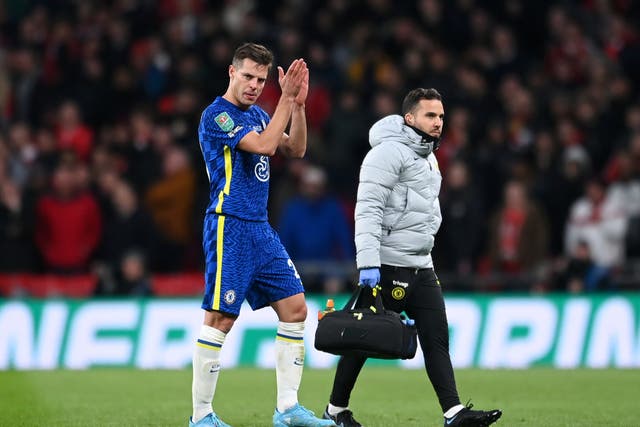 <p>Cesar Azpilicueta of Chelsea goes off with an injury during the Carabao Cup final</p>