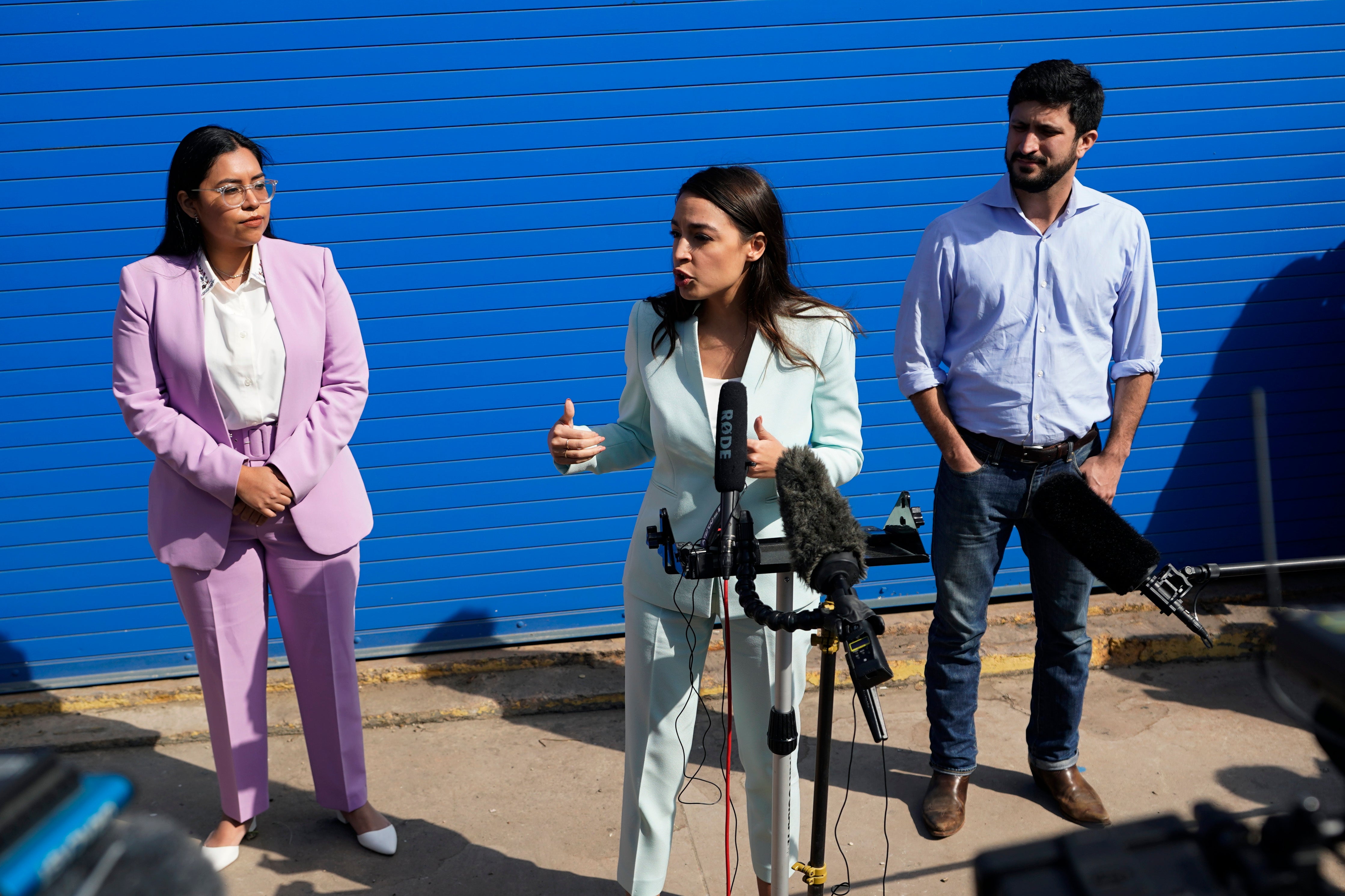 U.S. Rep. Alexandria Ocasio-Cortez, center, joins Democratic Congressional candidates Jessica Cisneros, left, and Greg Casar February 12, 2022, in San Antonio