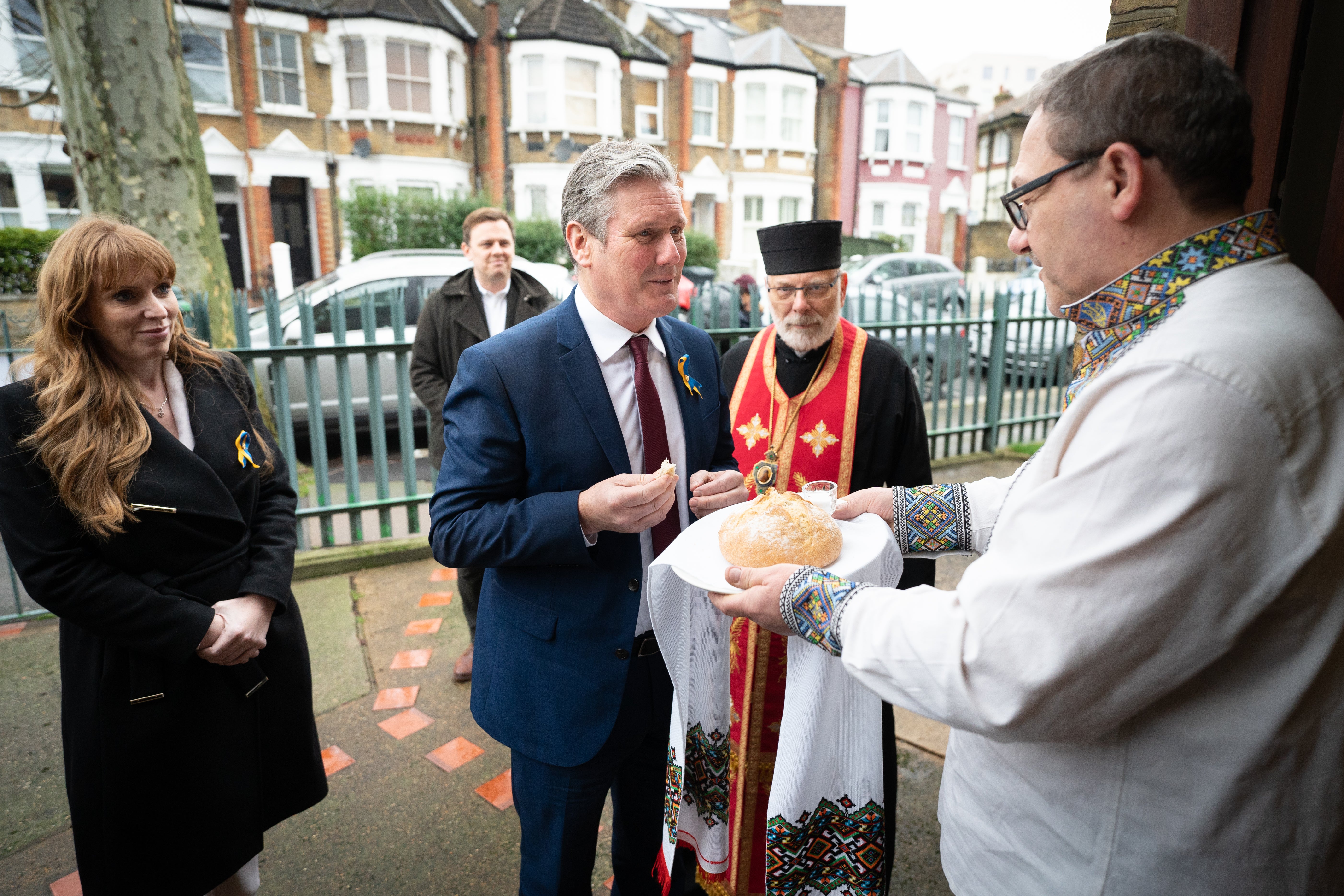 Sir Keir and deputy leader, Angela Rayner, ate a piece of bread dipped in salt before the visit (Stefan Rousseau/PA)