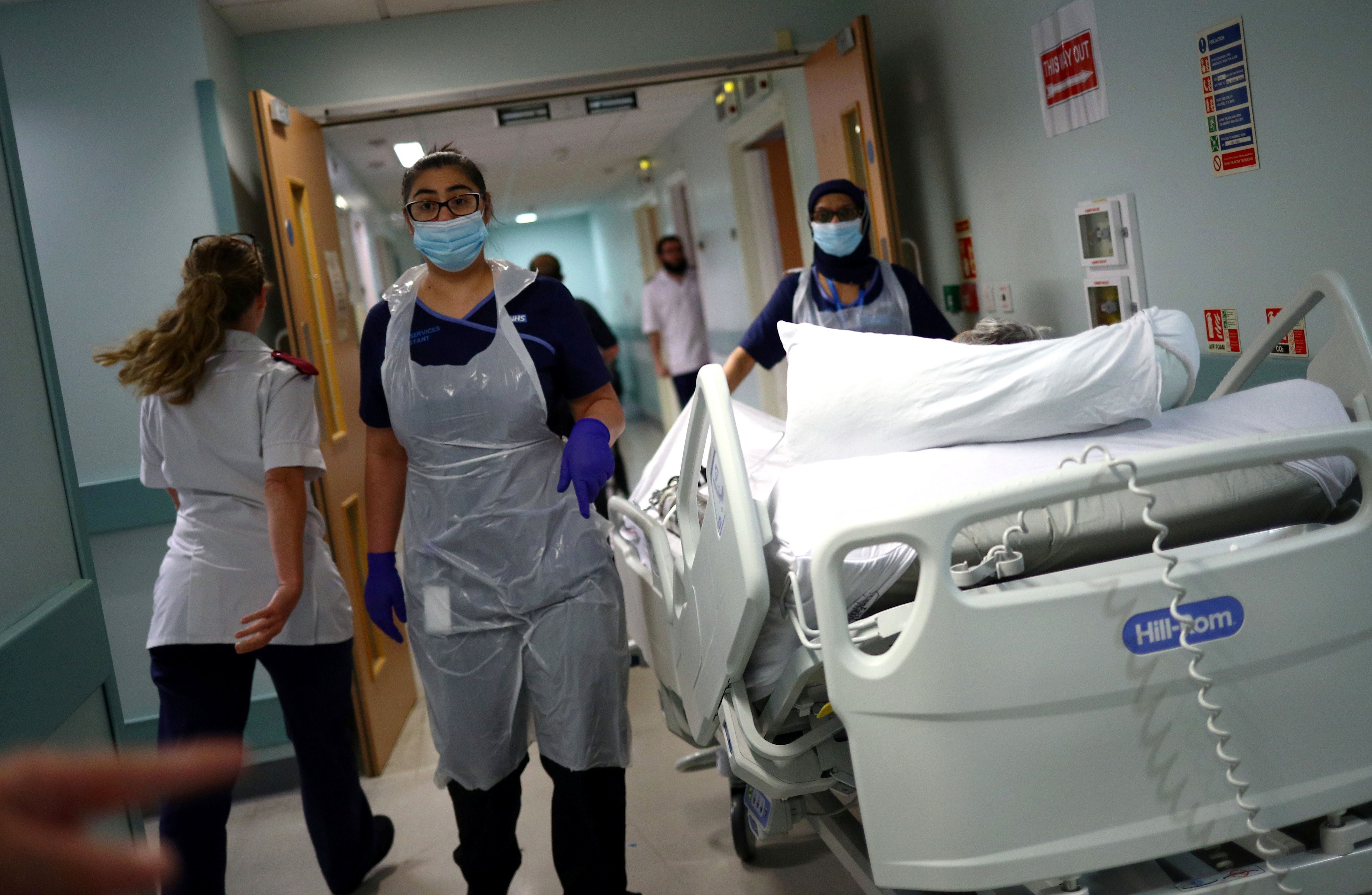 NHS staff in hospital corridor