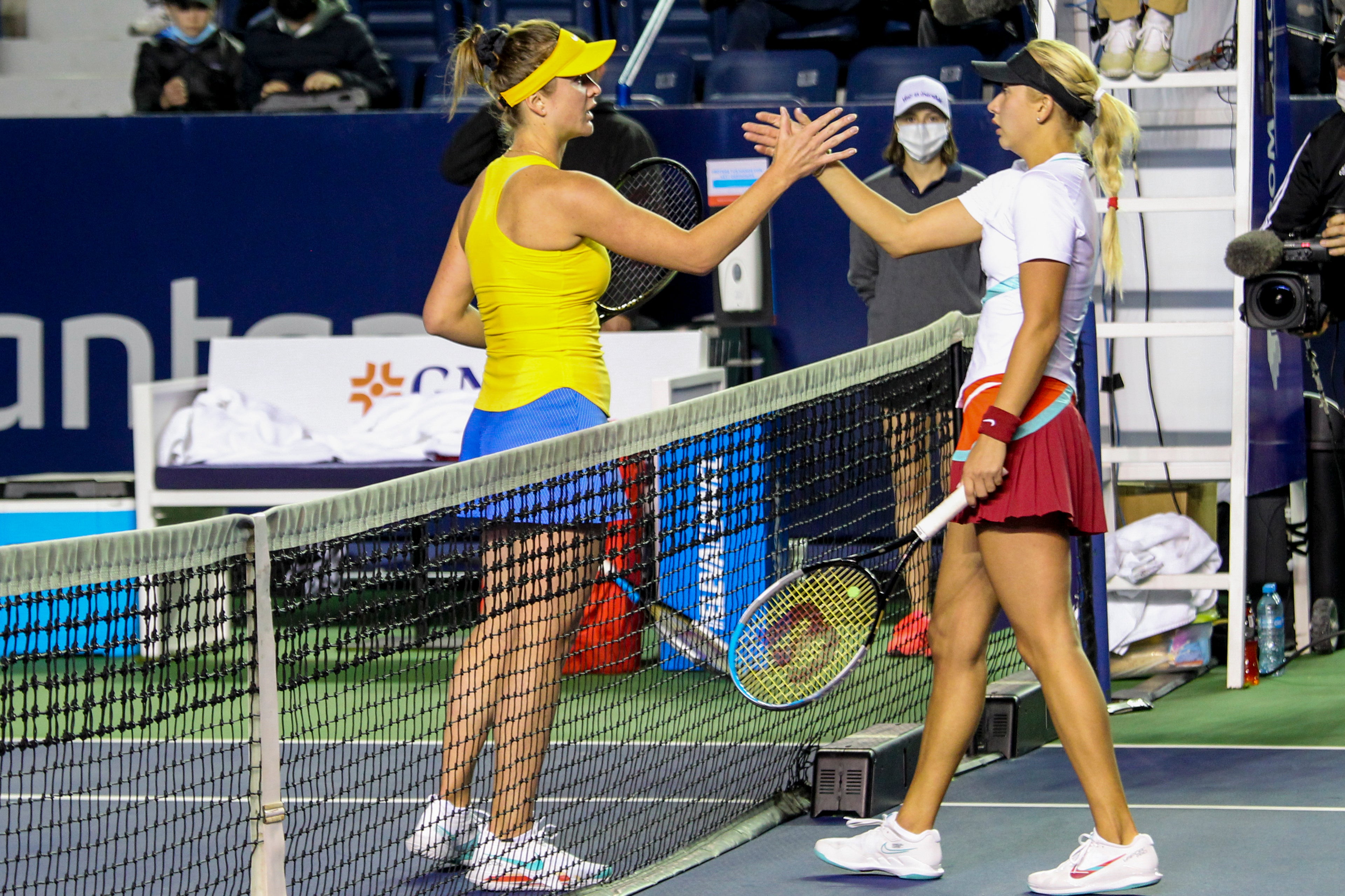 Elina Svitolina, left, wore the colours of her native Ukraine while thrashing Anastasia Potapova