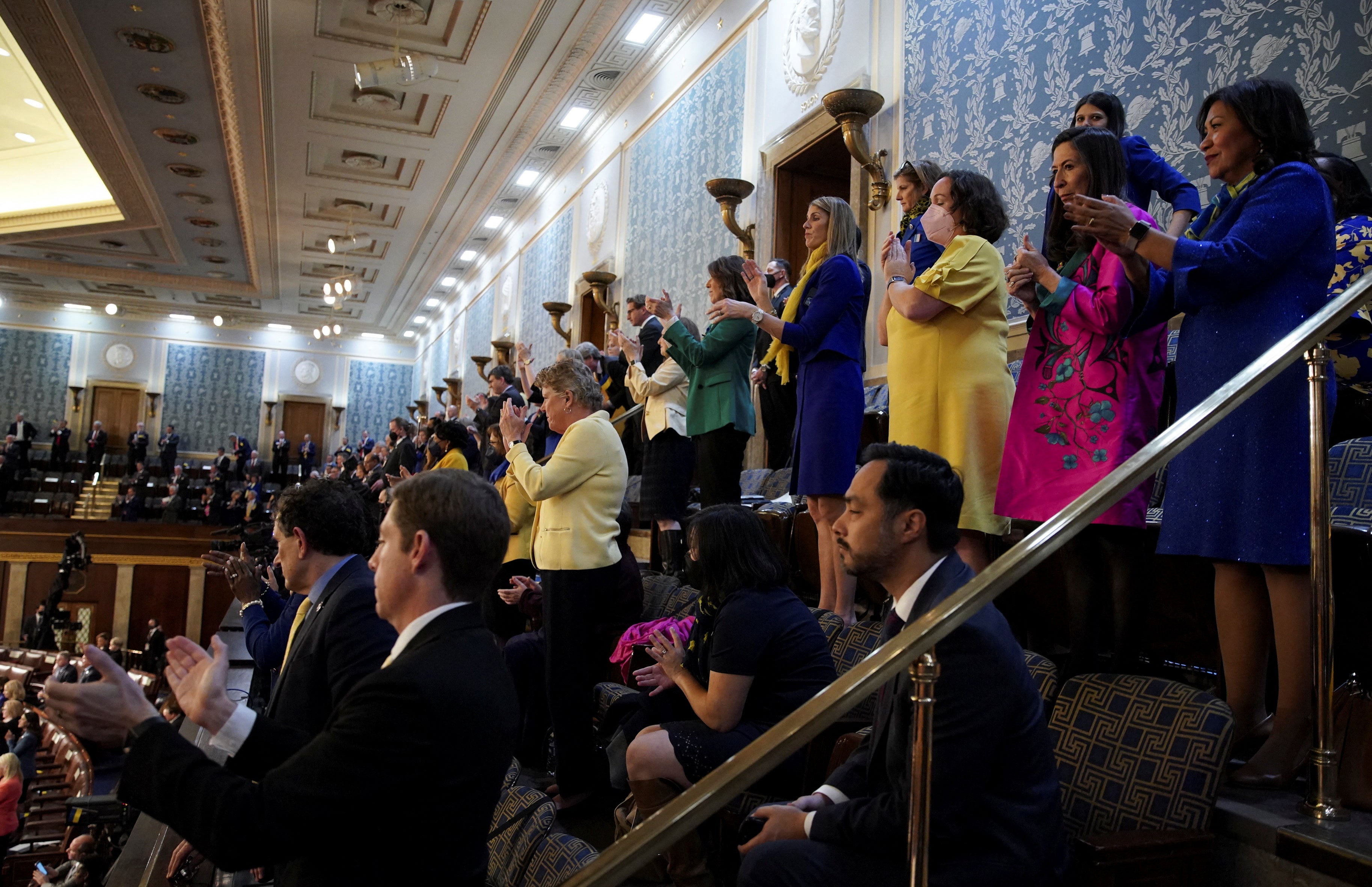 Attendees applaud while listening during the State of the Union address 2022