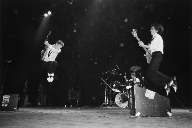 <p>Paul Weller, Rick Buckler and Bruce Foxton on stage at the Rainbow Theatre, London, in 1977</p>