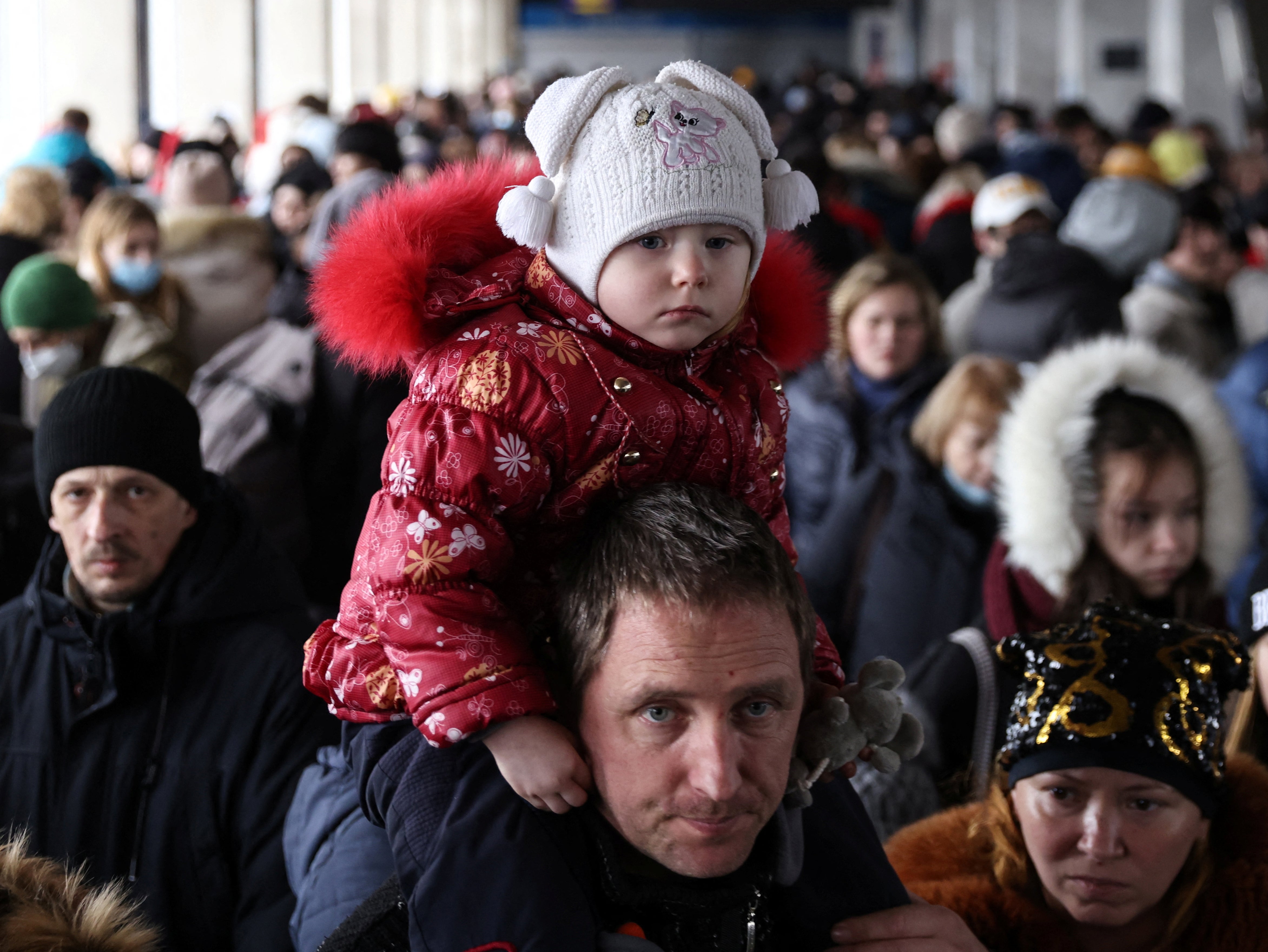 People wait to board a train from Kyiv to Lviv