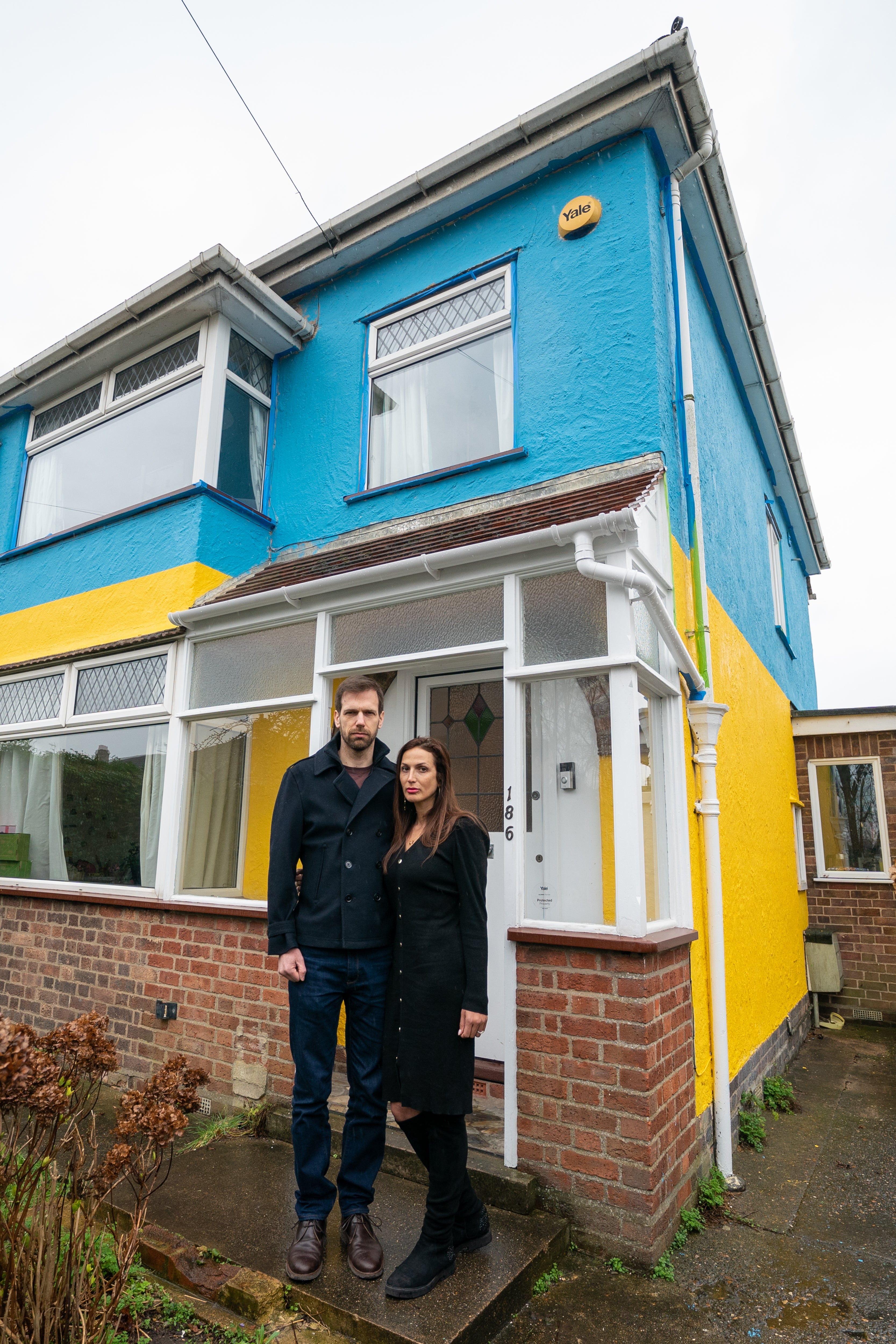Michael and Rend Platings have painted their home in Cambridge in the colours of the Ukraine flag in a show of support for friends in the country (Joe Giddens/PA)