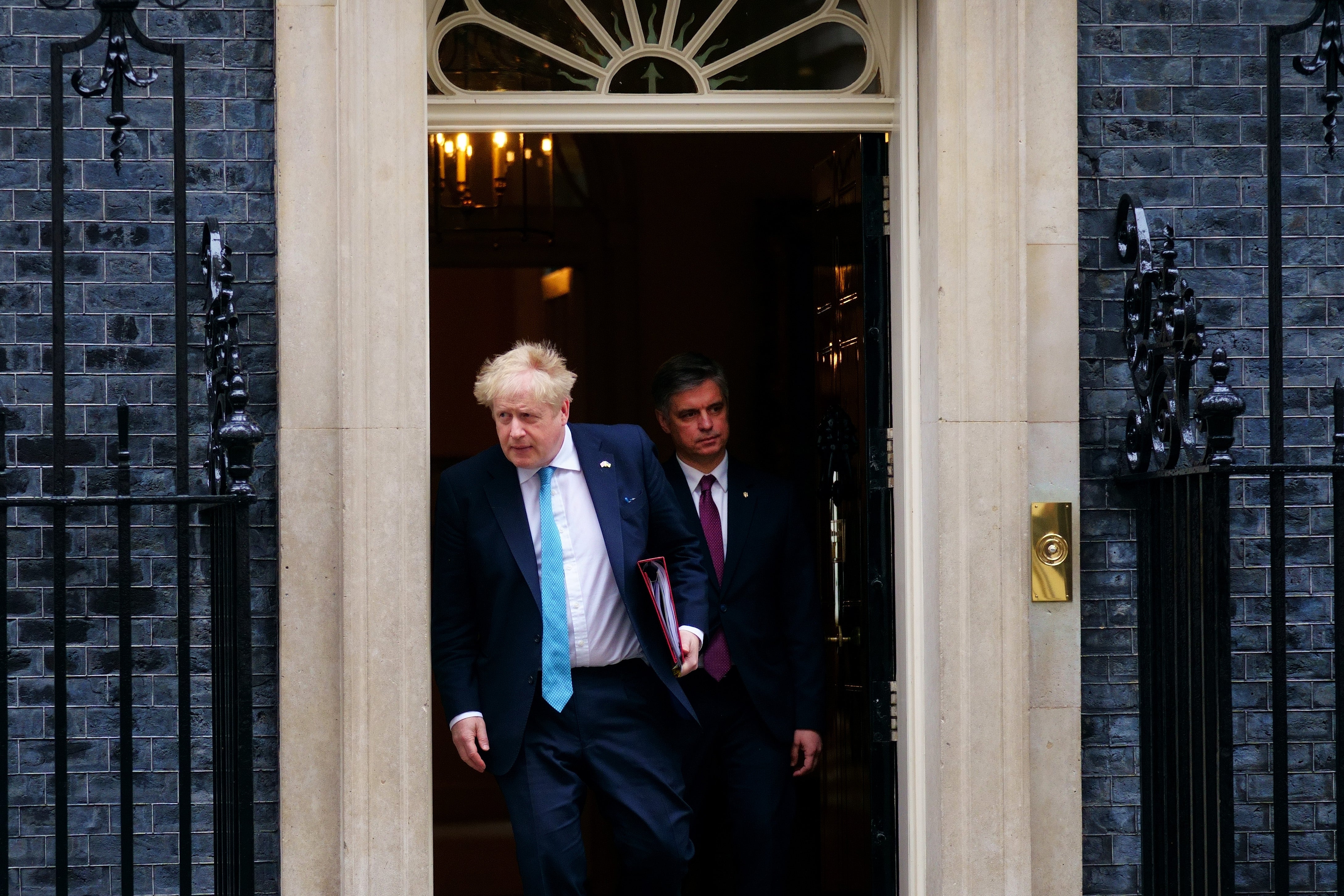 Prime Minister Boris Johnson leaves 10 Downing Street with Ukraine ambassador to the UK Vadym Prystaiko, to attend Prime Minister’s Questions (Victoria Jones/PA)