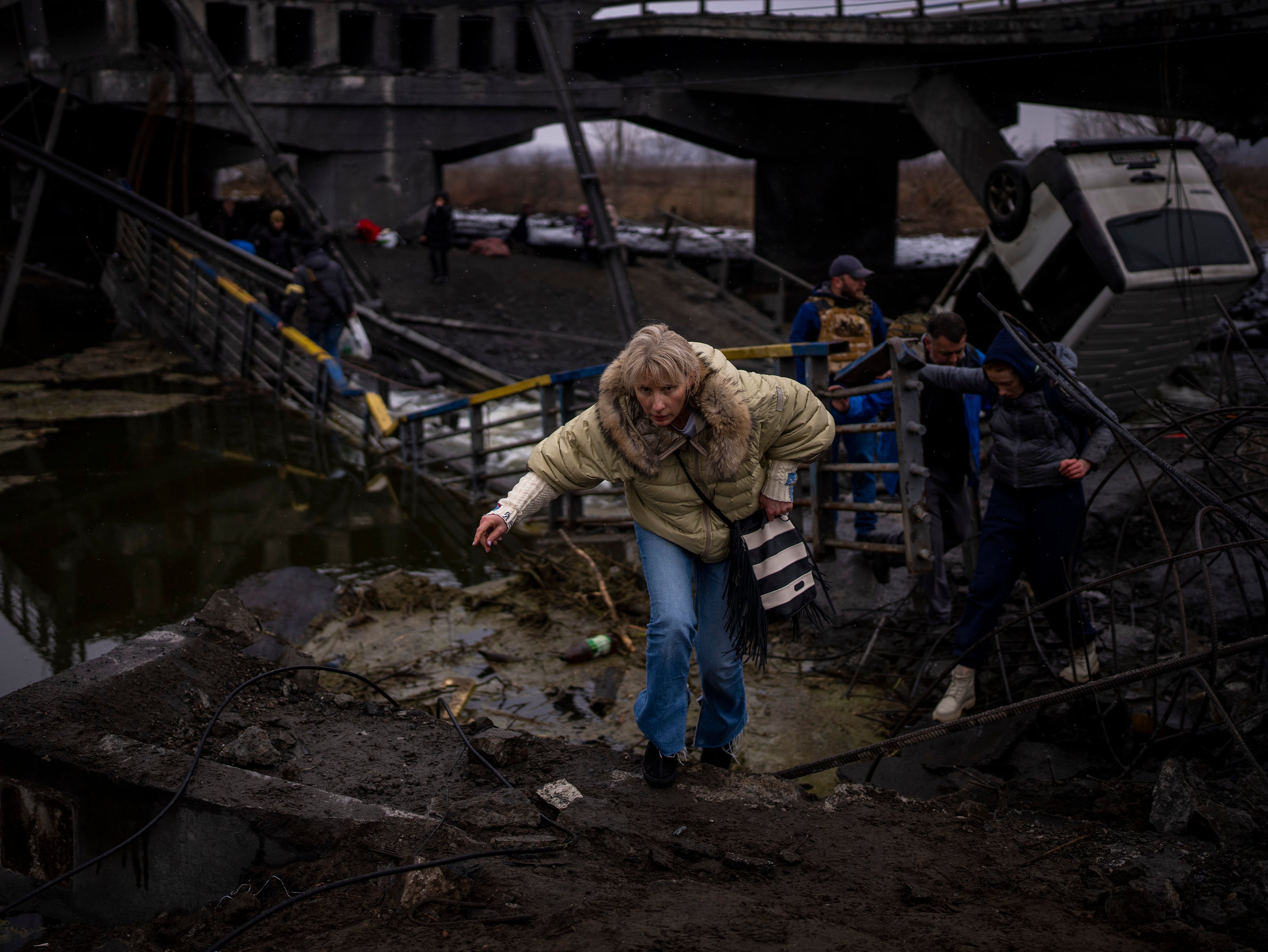 A woman fleeing the shelling