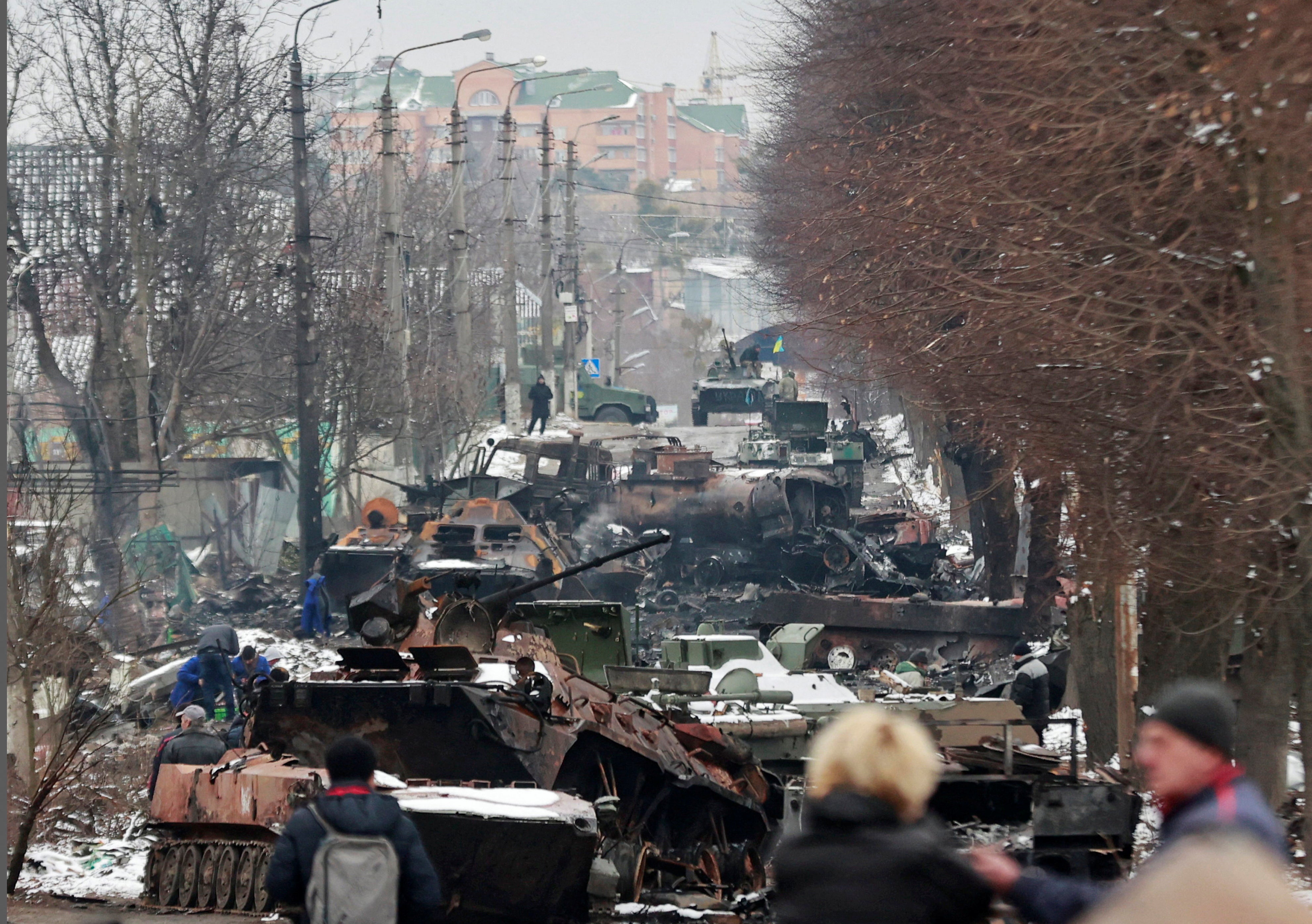 Destroyed military vehicles on a street in the town of Bucha in the Kyiv region