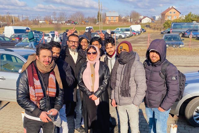 <p>A group of Yemeni students who fled Ukraine into Poland seen at the border with Yemeni ambassador to Poland and Ukraine, Dr Mervat Mojali </p>