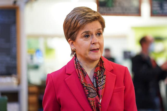 Nicola Sturgeon insisted ministers are ‘extremely committed’ to fulfilling an election pledge to offer all schoolchildren a free laptop or tablet (Peter Summers/PA)