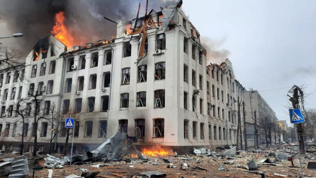 <p>Firefighters extinguish a fire in the Kharkiv regional police department building, which is claimed to have been hit by recent shelling</p>