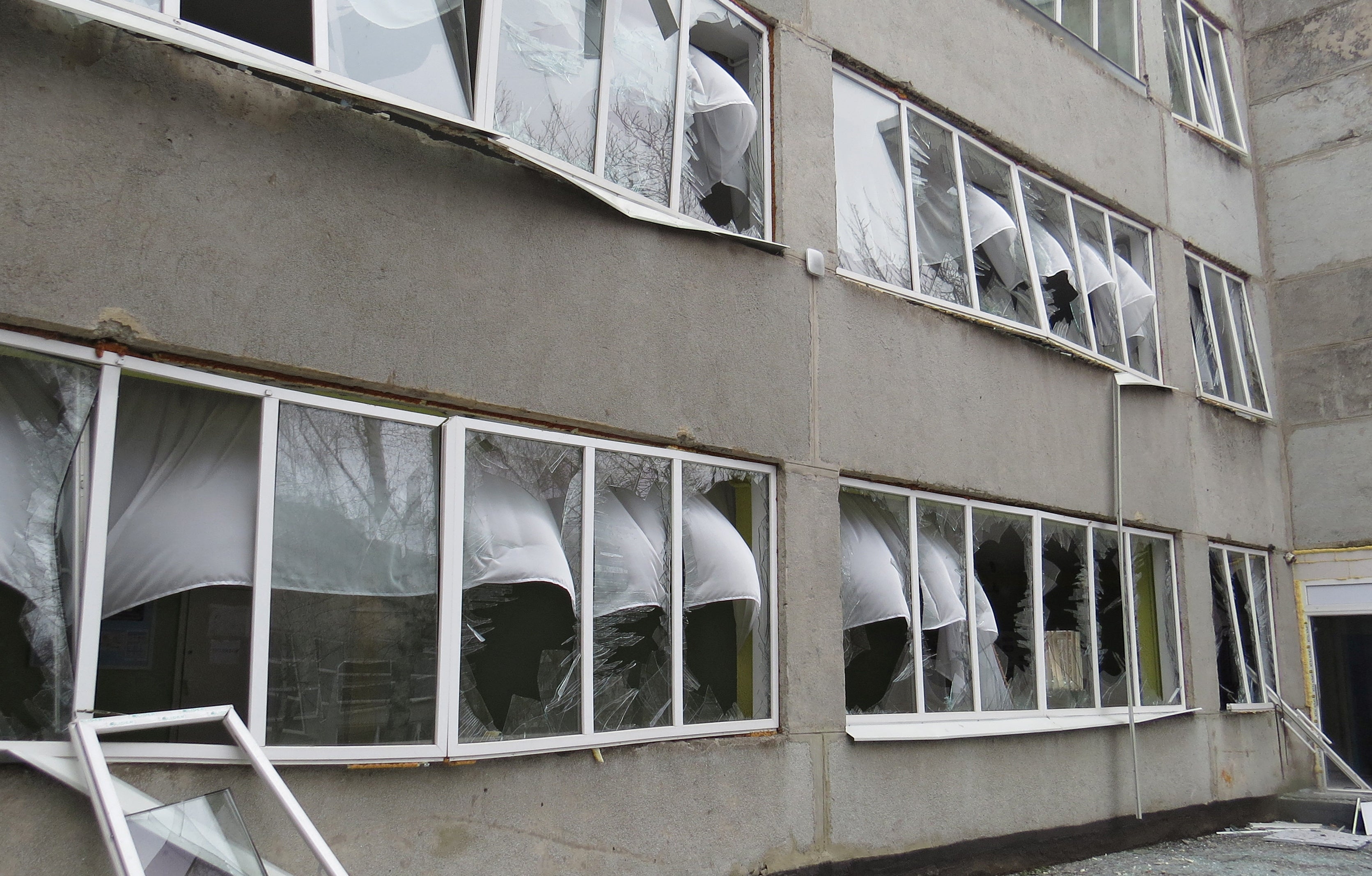 A view shows a school building which locals claim was damaged by recent shelling in Mariupol