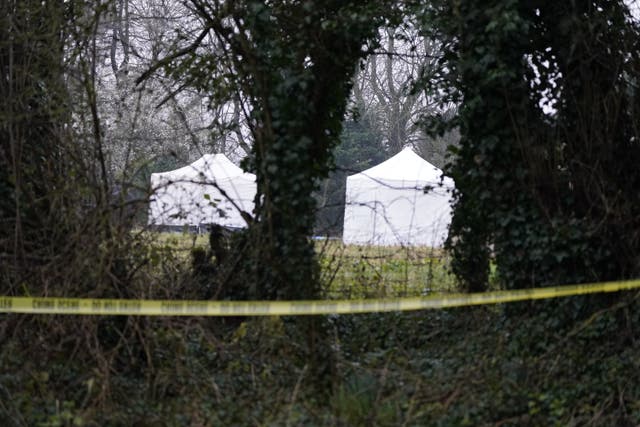 Forensic tents at the scene in Bourton-on-the-Water in Gloucestershire, where police are investigating after a body of a woman was found, following the earlier discovery of a man’s body in Cheltenham, on Wednesday morning (Andrew Matthews/PA)