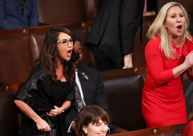 <p>Lauren Boebert and Marjorie Taylor Greene shouting during the SOTU on Tuesday </p>