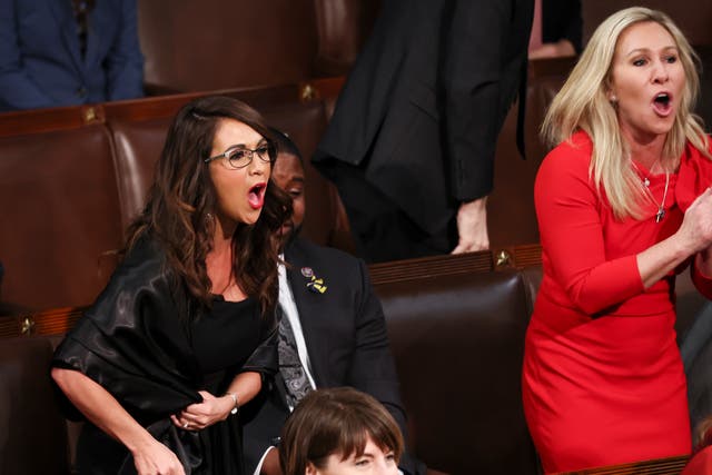 <p>Lauren Boebert and Marjorie Taylor Greene shouting during the SOTU on Tuesday </p>