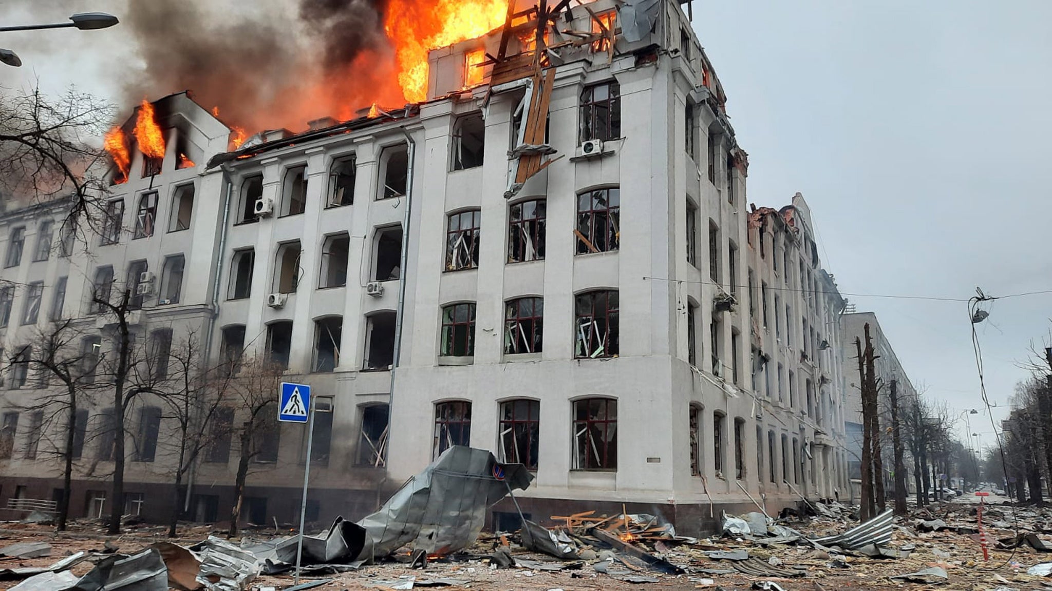 A photo released by the press service of the State Emergency Service of Ukraine shows a fire in a building of the Security Service of Ukraine (SBU) after shelling in Kharkiv