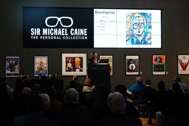 A portrait of Sir Michael Caine by artist John Bratby R.A. sells for ?25,000 during the Sir Michael Caine collection sale at Bonhams in London. The sale contains a selection of items reflecting the breadth of Sir Michael’s career, ranging from movie posters, furniture including his desk, works of art and fine art (Aaron Chown/PA)
