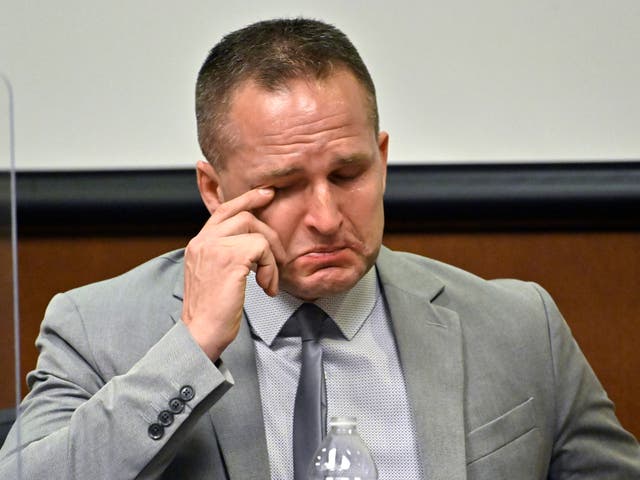 <p>Former Louisville Police officer Brett Hankison wipes a tear from his eye as he is questioned by his defense attorney Wednesday, March 2, 2022, in Louisville, Ky. Hankison is currently on trial, charged with wanton endangerment for shooting through Breonna Taylor's apartment into the home of her neighbors during botched police raid that killed Taylor. (AP Photo/Timothy D. Easley, Pool)</p>