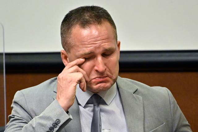 <p>Former Louisville Police officer Brett Hankison wipes a tear from his eye as he is questioned by his defense attorney Wednesday, March 2, 2022, in Louisville, Ky. Hankison is currently on trial, charged with wanton endangerment for shooting through Breonna Taylor's apartment into the home of her neighbors during botched police raid that killed Taylor. (AP Photo/Timothy D. Easley, Pool)</p>