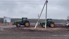 Ukraine invasion: Tractors appear to tow away abandoned Russian tank