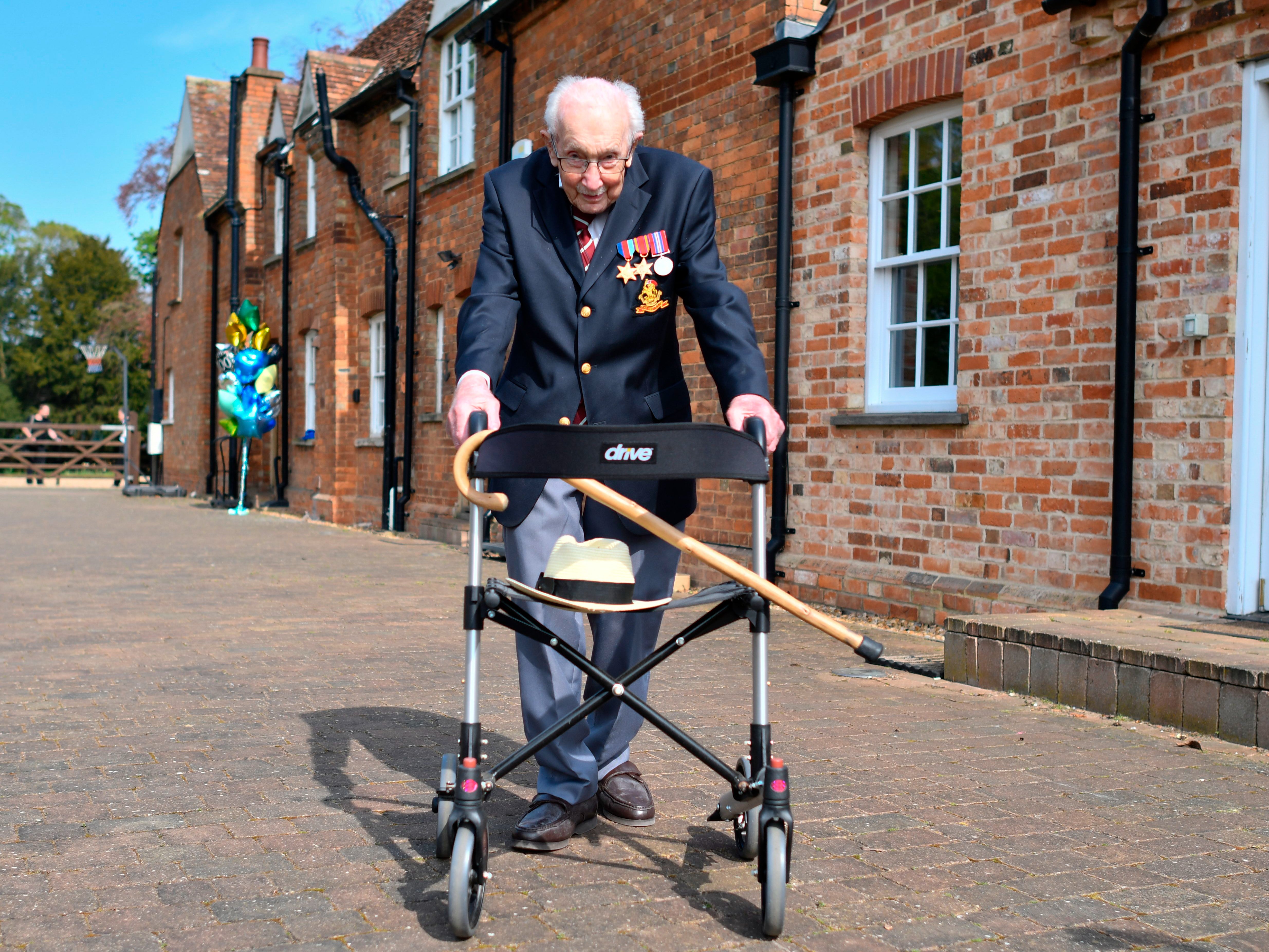 Captain Tom with his walking frame doing a lap of his garden in the Bedfordshire village of Marston Moretaine inApril 2020