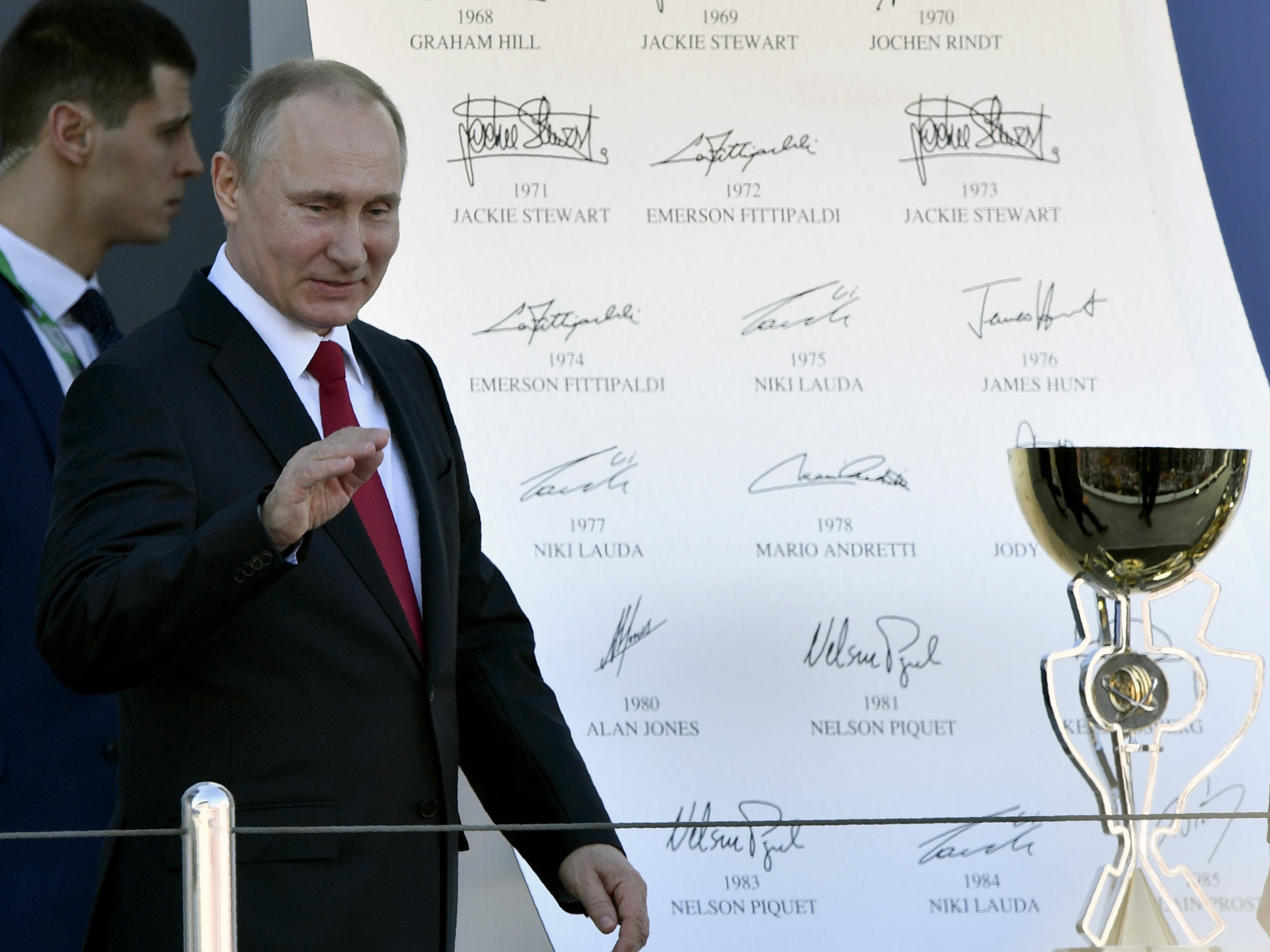 Vladimir Putin presents the trophy at the Russian Grand Prix in 2017