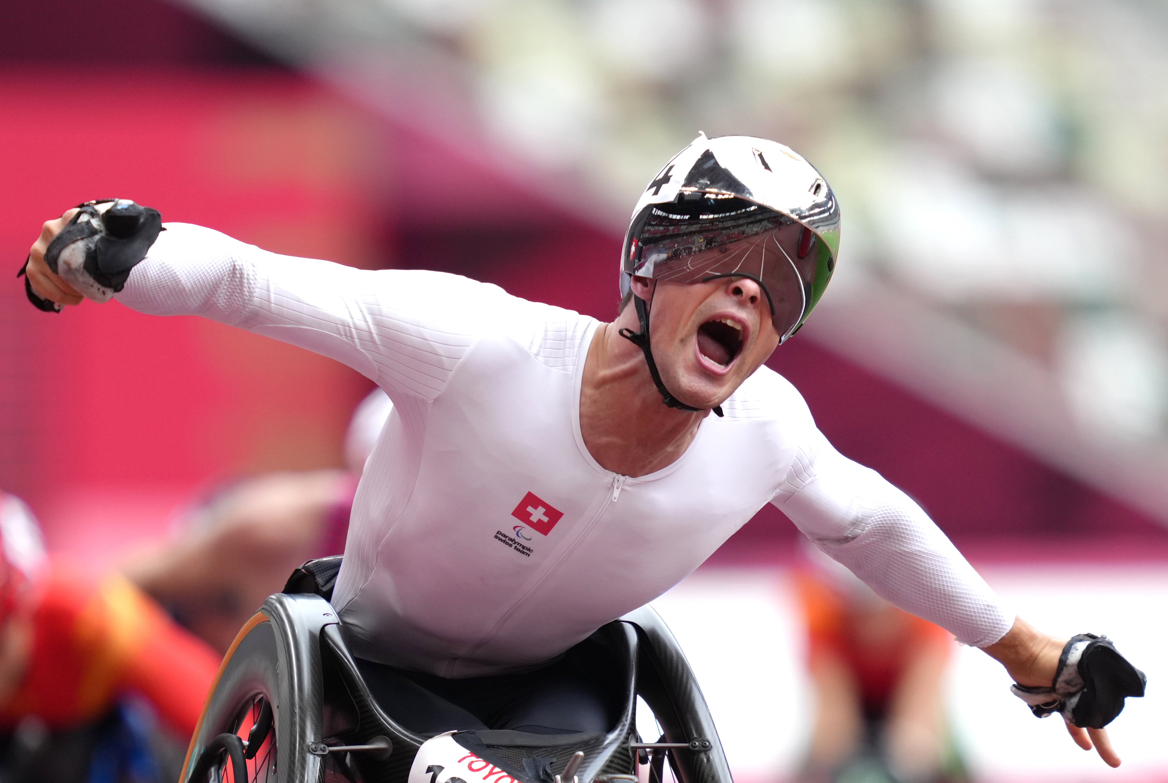 Marcel Hug celebrates winning the 5,000 metres at the Tokyo Paralympics (John Walton/PA)
