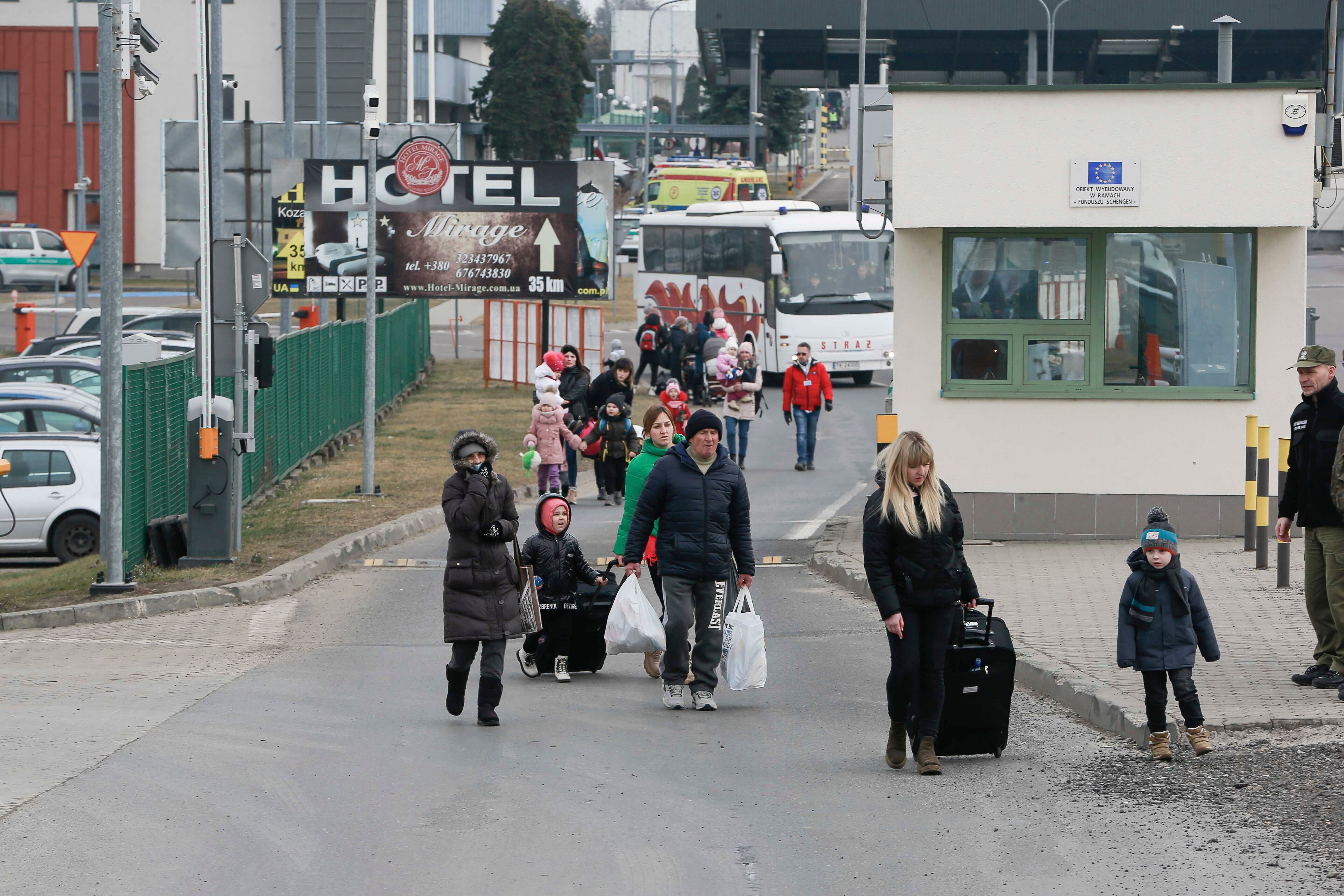 People arrive at a border crossing in Medyka, Poland (Visar Kryeziu/AP/PA)