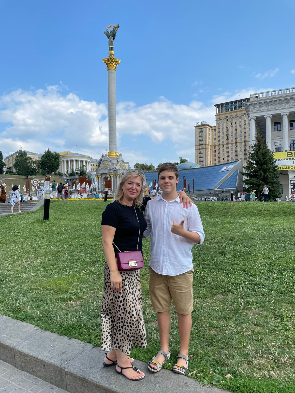 Nikita Dudchenko, 14, with his mother in Kyiv (Yana Protsenko)