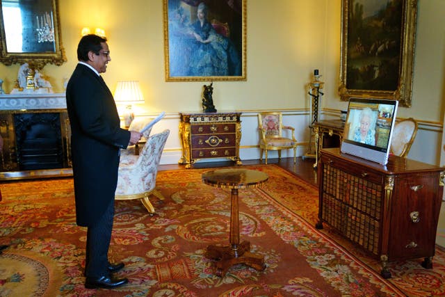 The Queen appears on a screen via video link from Windsor Castle, where she is in residence, during a virtual audience to receive the High Commissioner of Trinidad and Tobago, Vishnu Dhanpaul, at Buckingham Palace (PA)