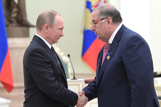 <p>Russian president Vladimir Putin with Alisher Usmanov, founder of USM Holdings group, during a ceremony at the Kremlin</p>