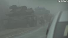 Russian troops aim tank barrel directly at ITV journalists leaving Mariupol