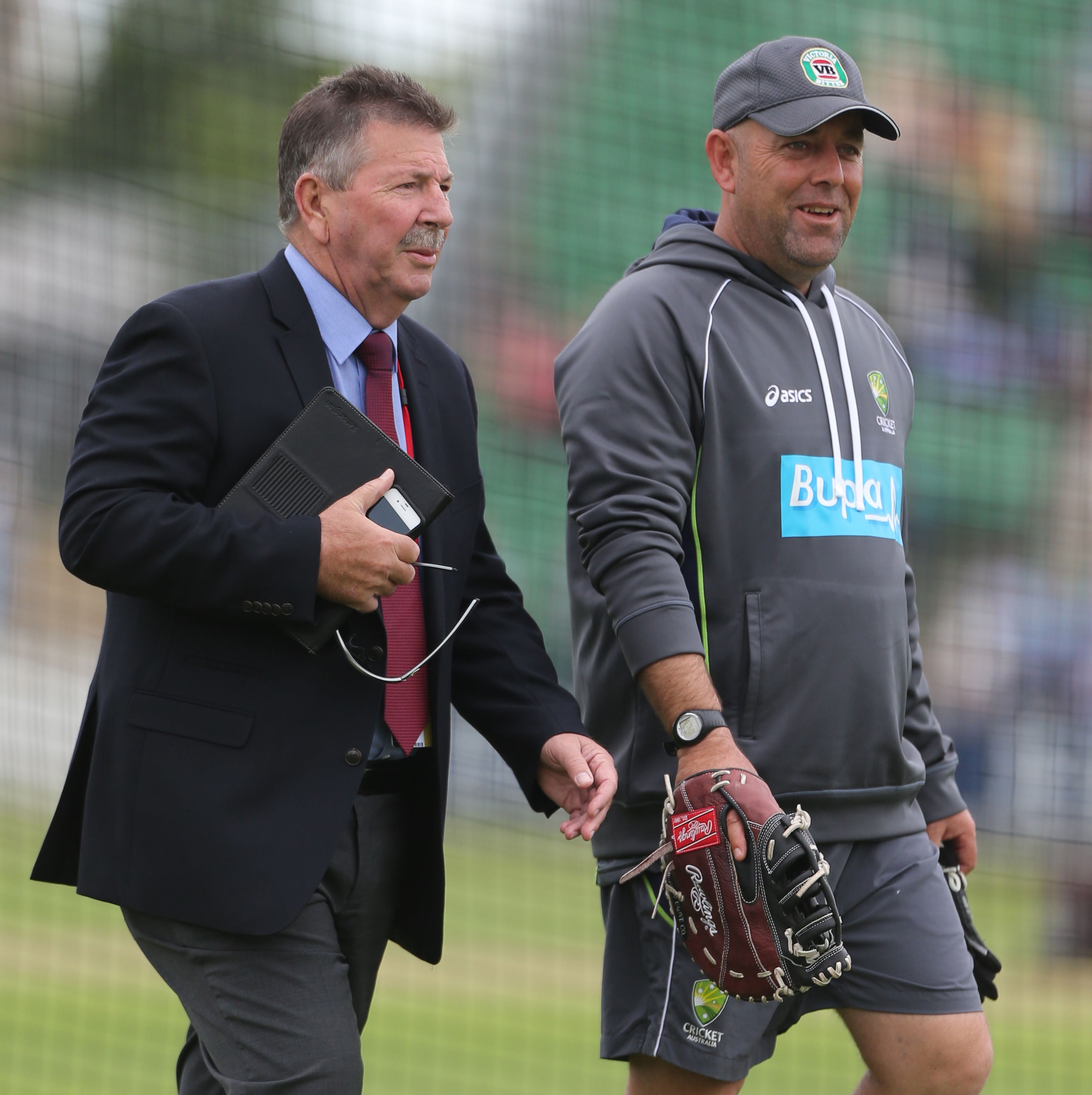 Australia coach Darren Lehmann (right) talks with Marsh after he returned to work for the Baggy Green (PA)