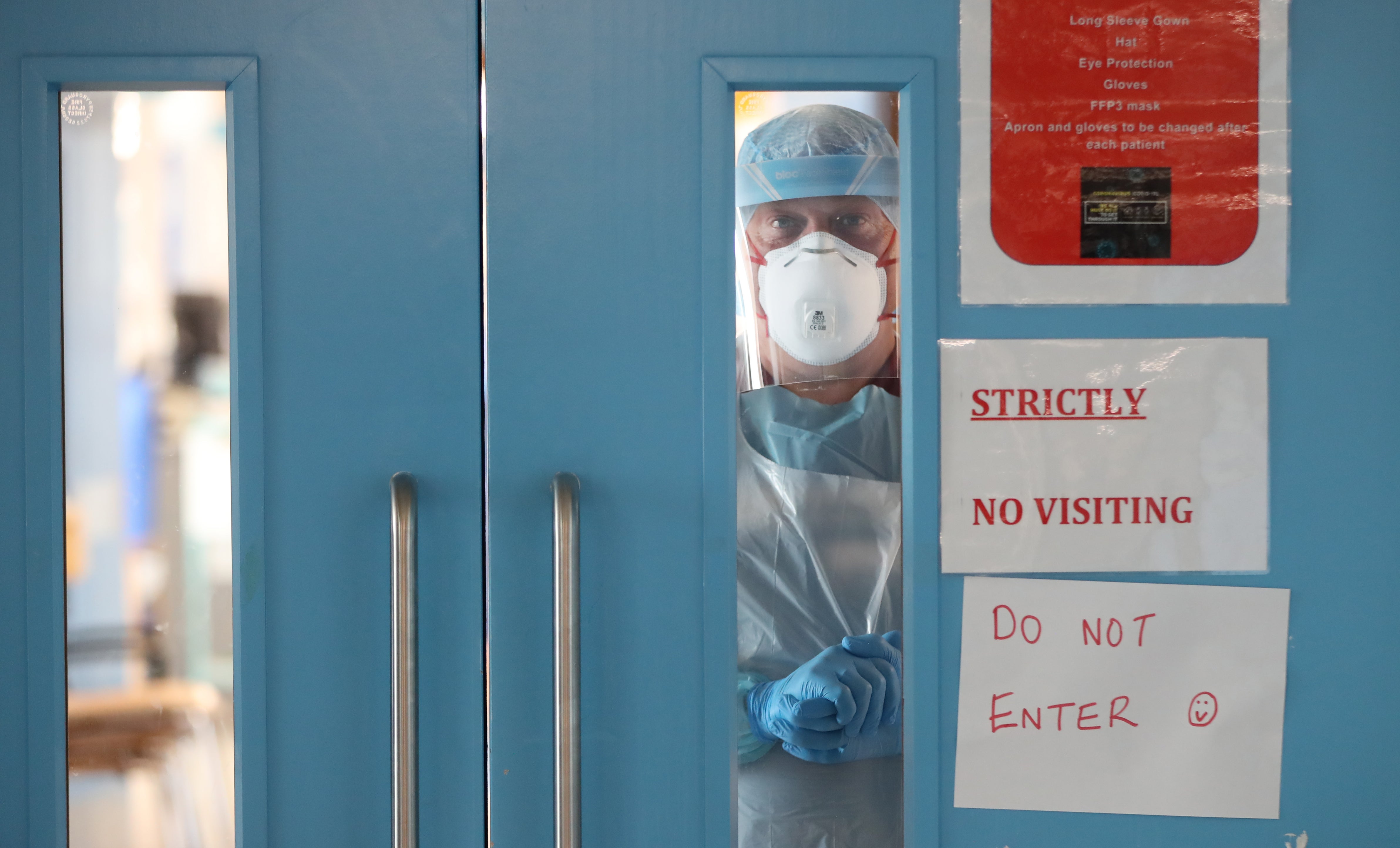 Infection Control nurse Colin Clarke looks out from a Covid-19 recovery ward at Craigavon Area Hospital in Co Armagh, Northern Ireland (PA)