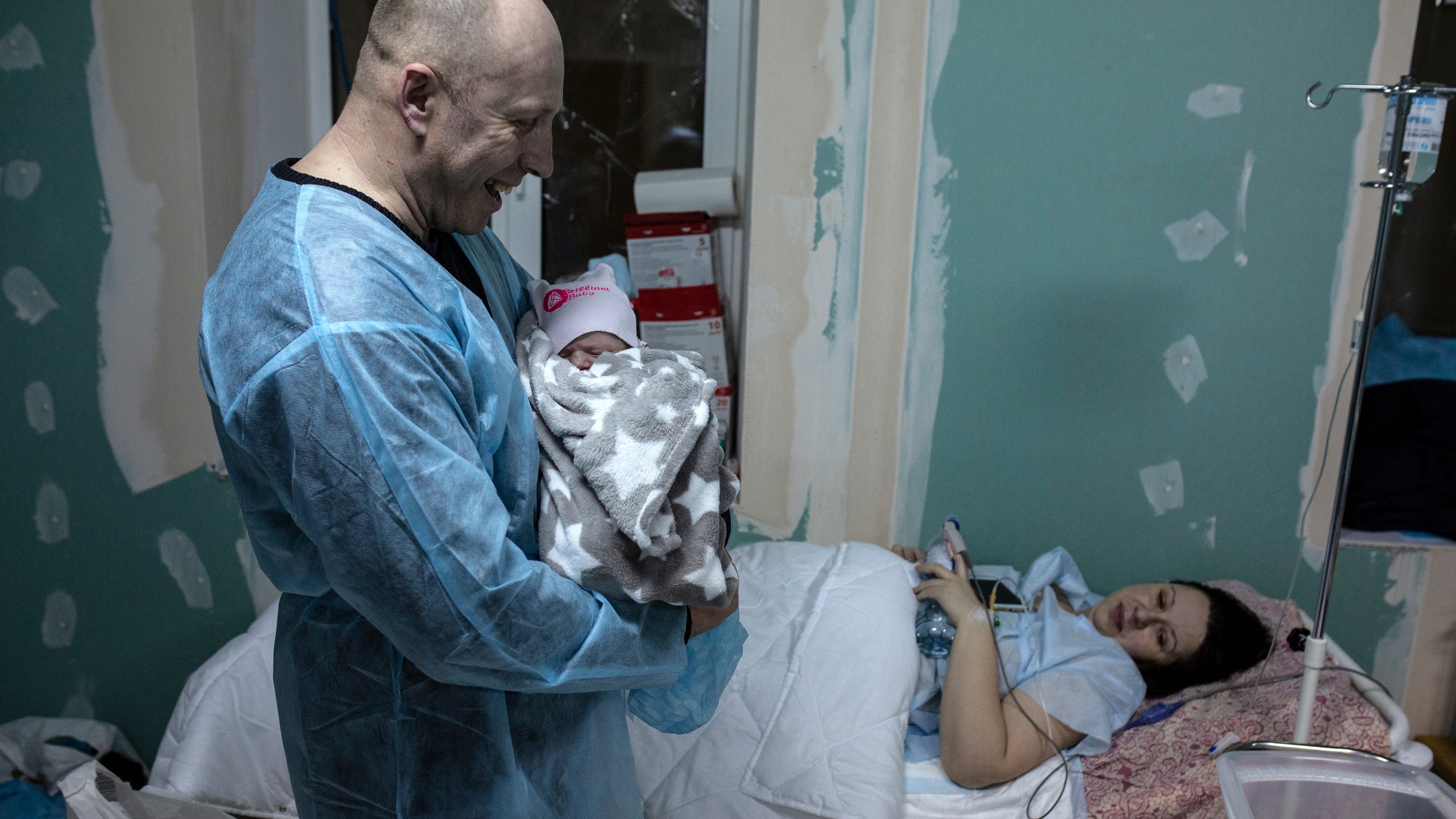 New parents Yola and Alexi with their newborn in an underground maternity shelter at Kyiv Maternity Hospital