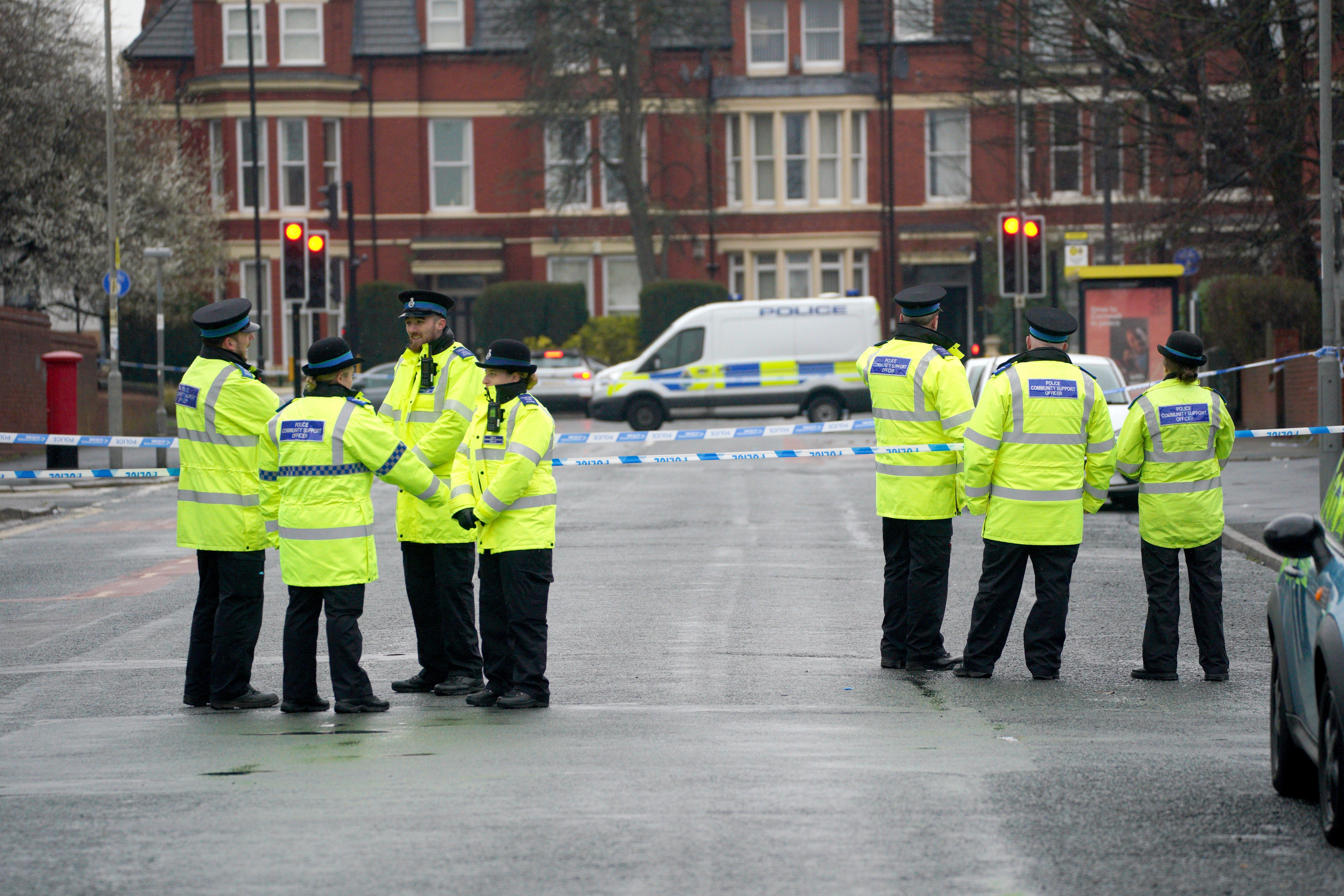 Police community support officers at the scene in Upper Warwick Street in Toxteth, Liverpool, after a teenage girl was seriously injured in a shooting (Peter Byrne/PA)