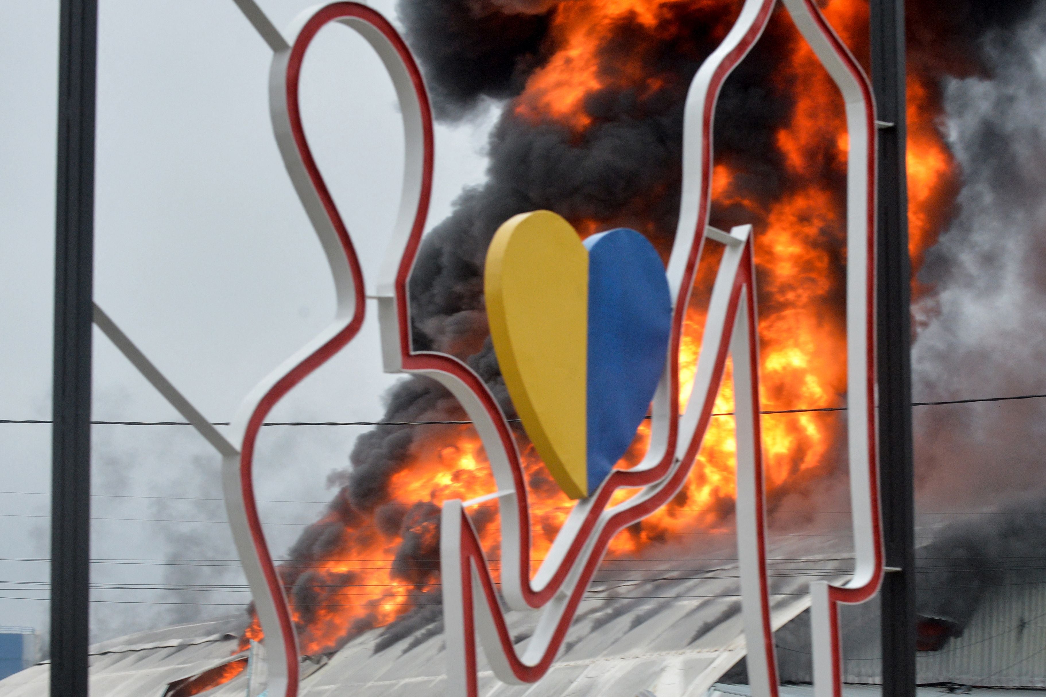 A building burns following Russian shelling in Ukraine’s second-biggest city of Kharkiv