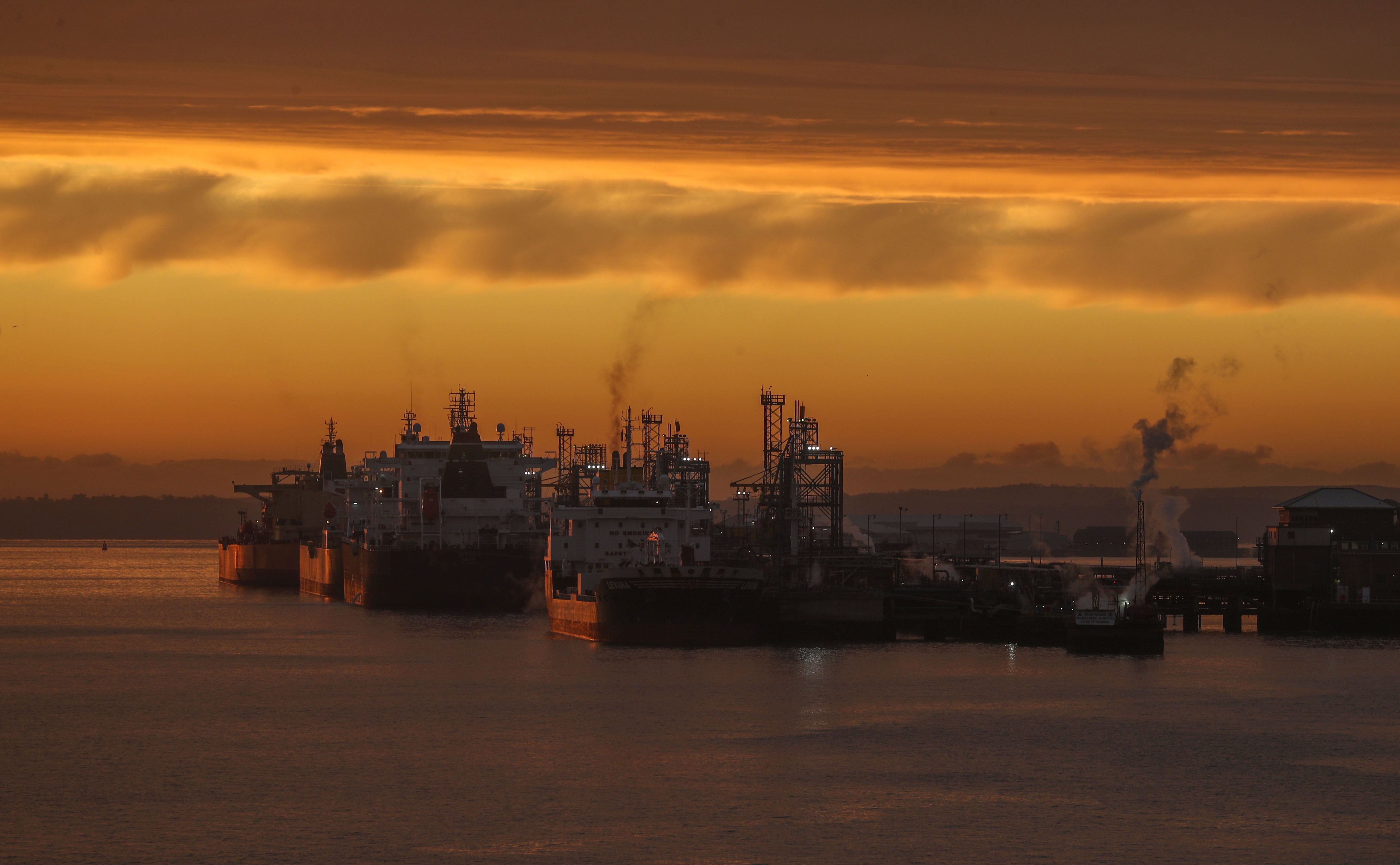 The sun rises over oil tankers (Steve Parsons/PA)