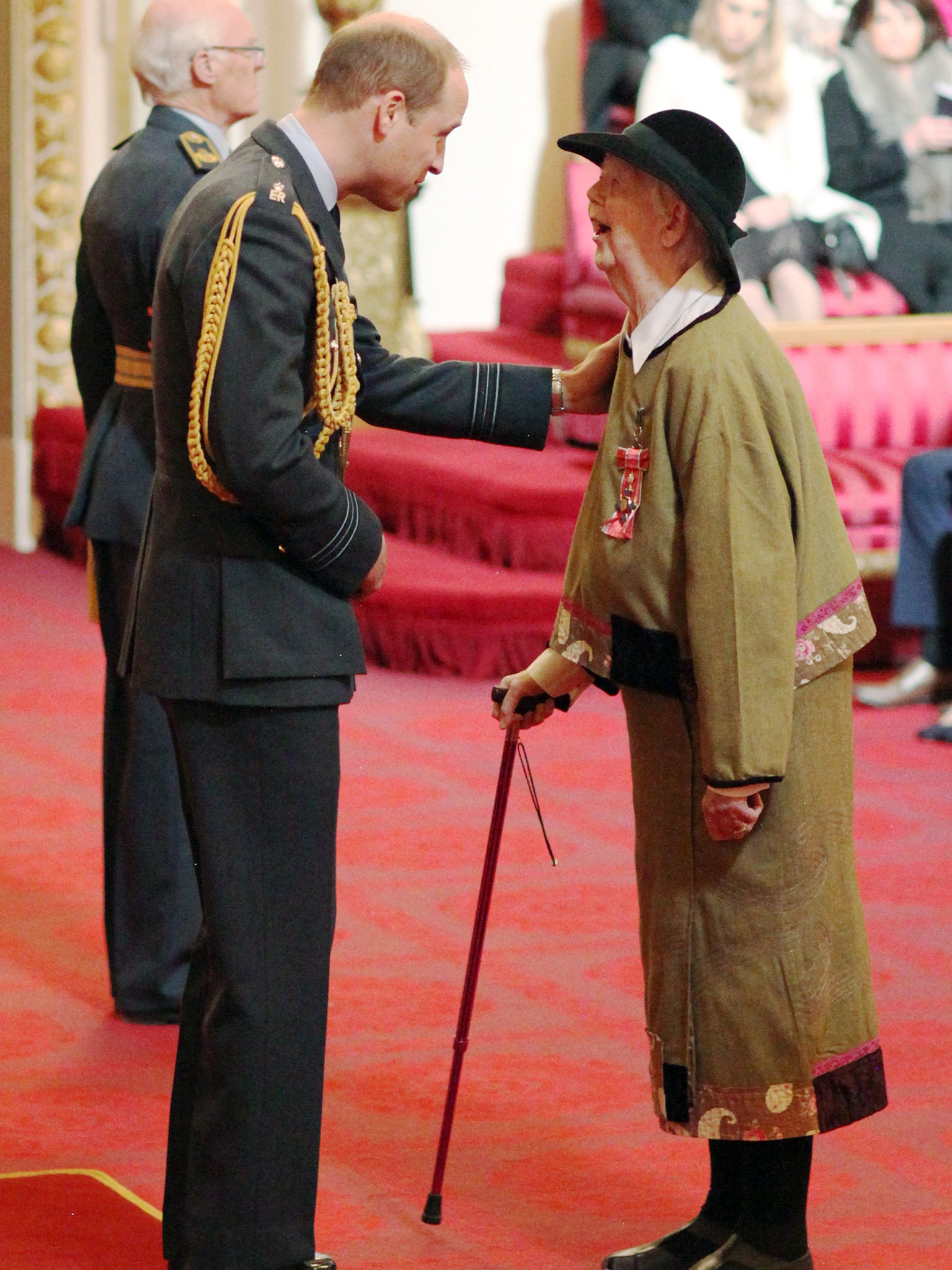 Hughes is made a CBE by the Duke of Cambridge at Buckingham Palace in 2017