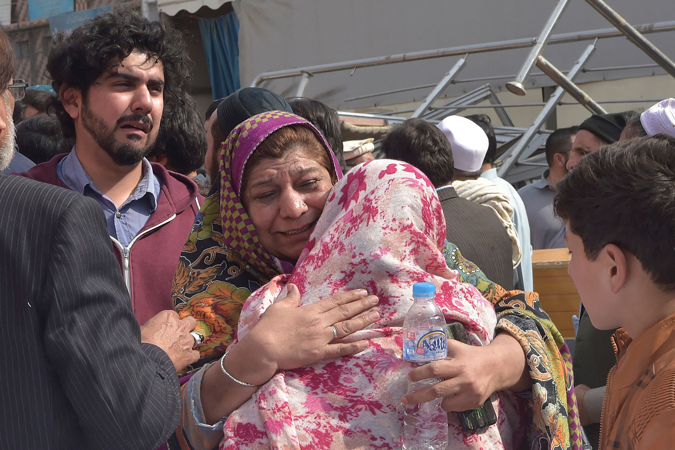 Mourners outside a hospital following the explosion in Peshawar