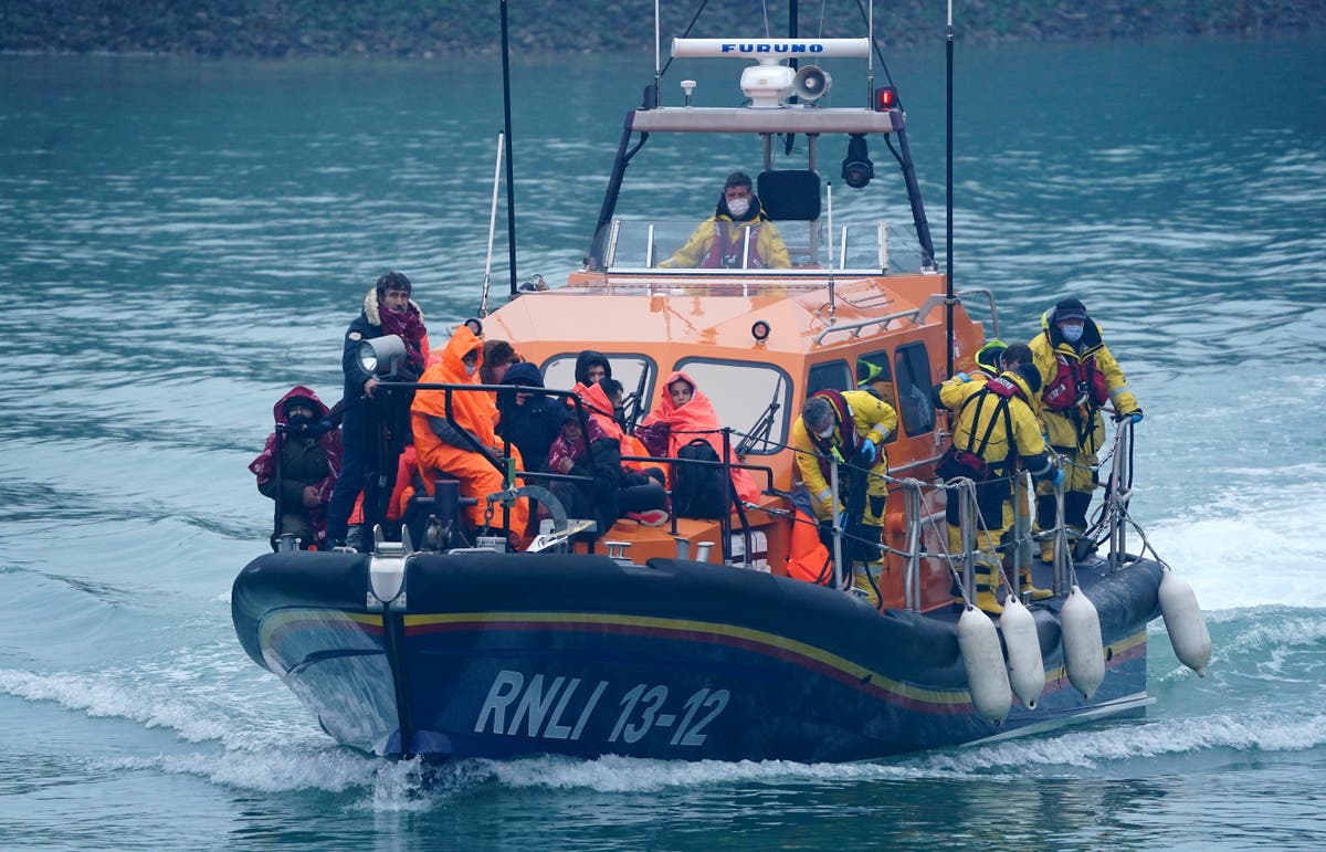Migrants brought ashore by RNLI and Border Force after crossing Channel