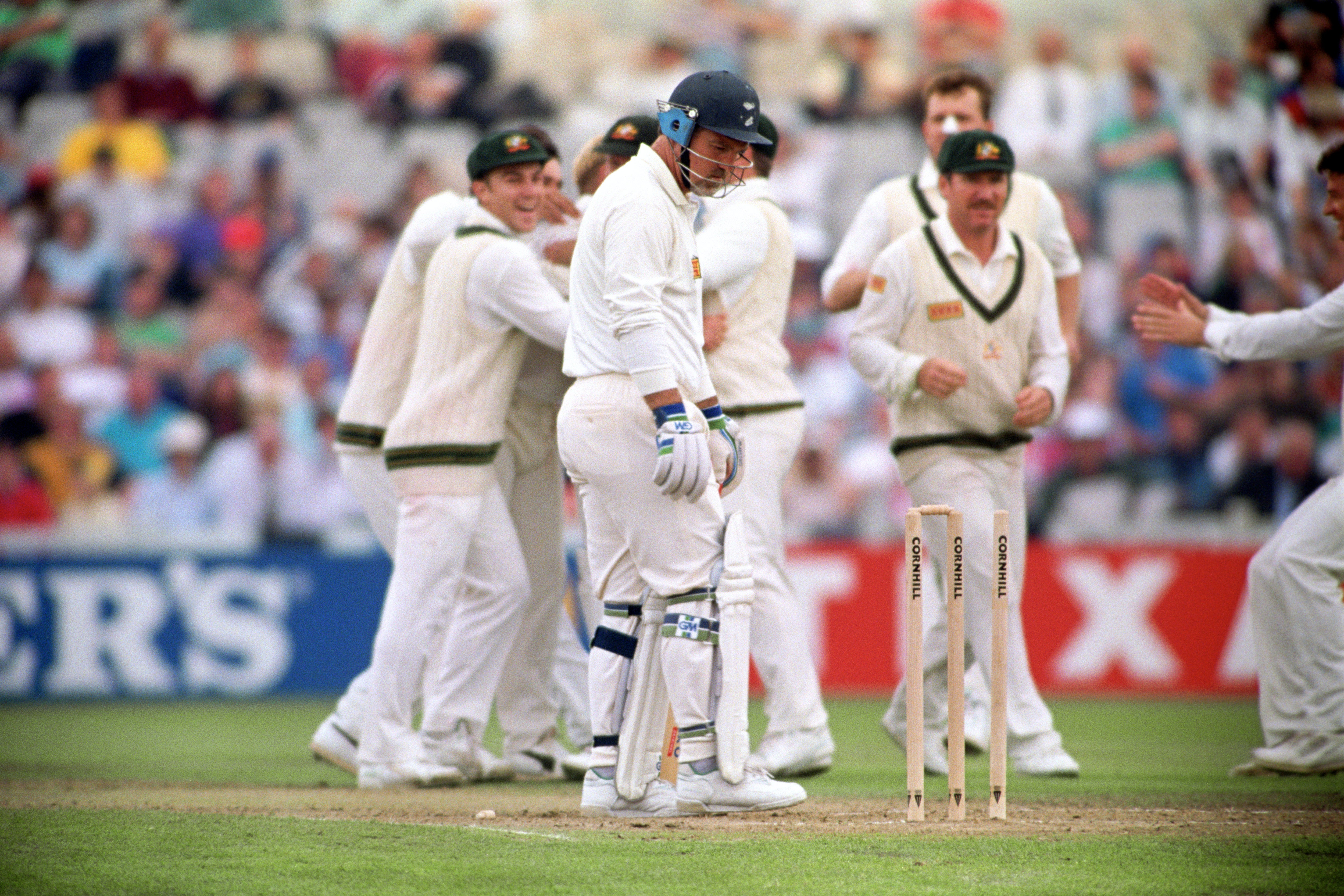 England’s Mike Gatting (centre) is stunned after being bowled by Shane Warne’s ‘ball of the century’ at Old Trafford.