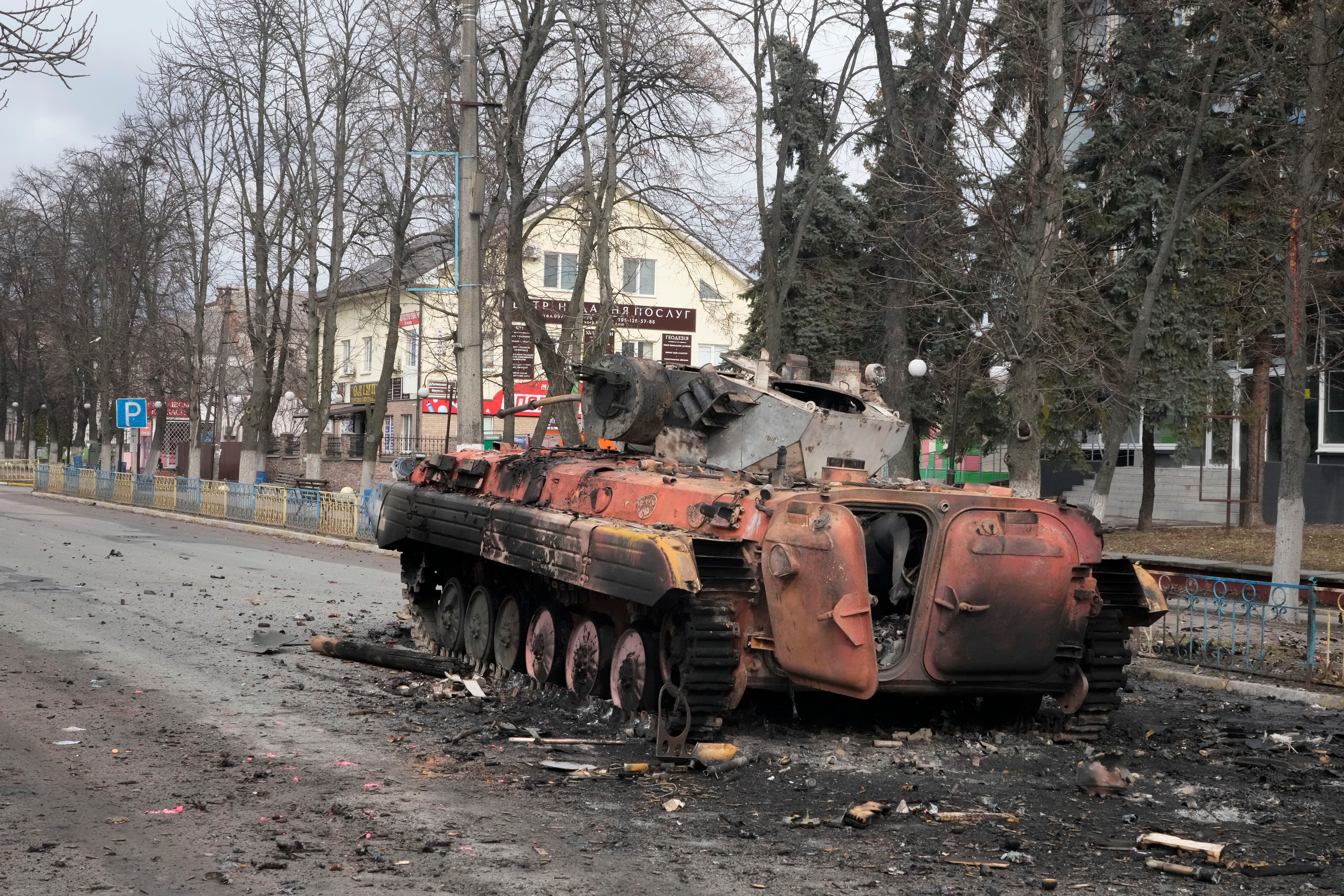 A destroyed armoured personnel carrier stands in the central square of the town of Makariv, 60 kilometres west of Kyiv, Ukraine, after a heavy night battle (Efrem Lukatsky/AP)